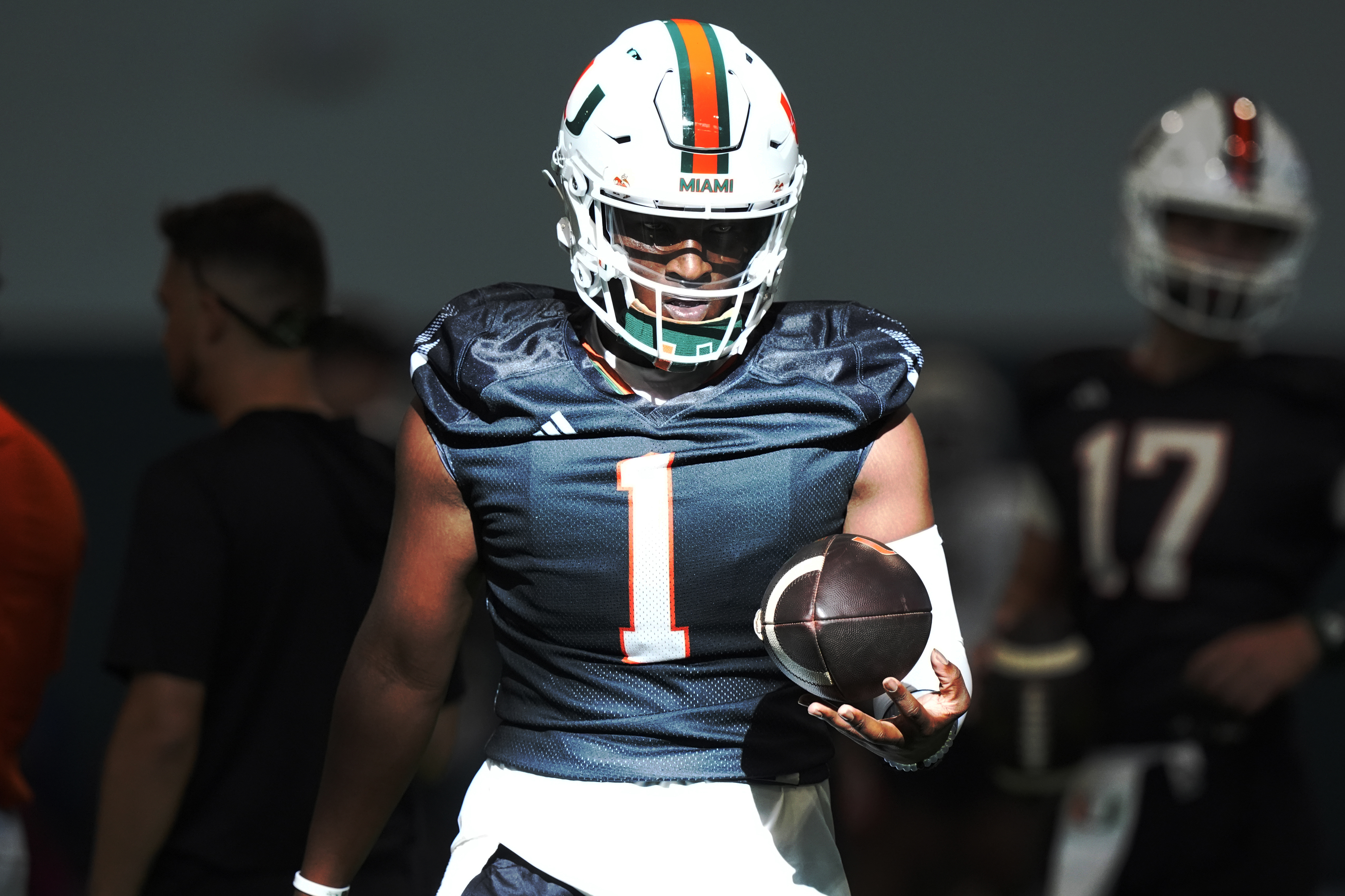 Miami quarterback Cam Ward (1) holds the ball during NCAA college football practice, Wednesday, July 31, 2024, in Coral Gables, Fla. (AP Photo/Marta Lavandier) (Marta Lavandier)