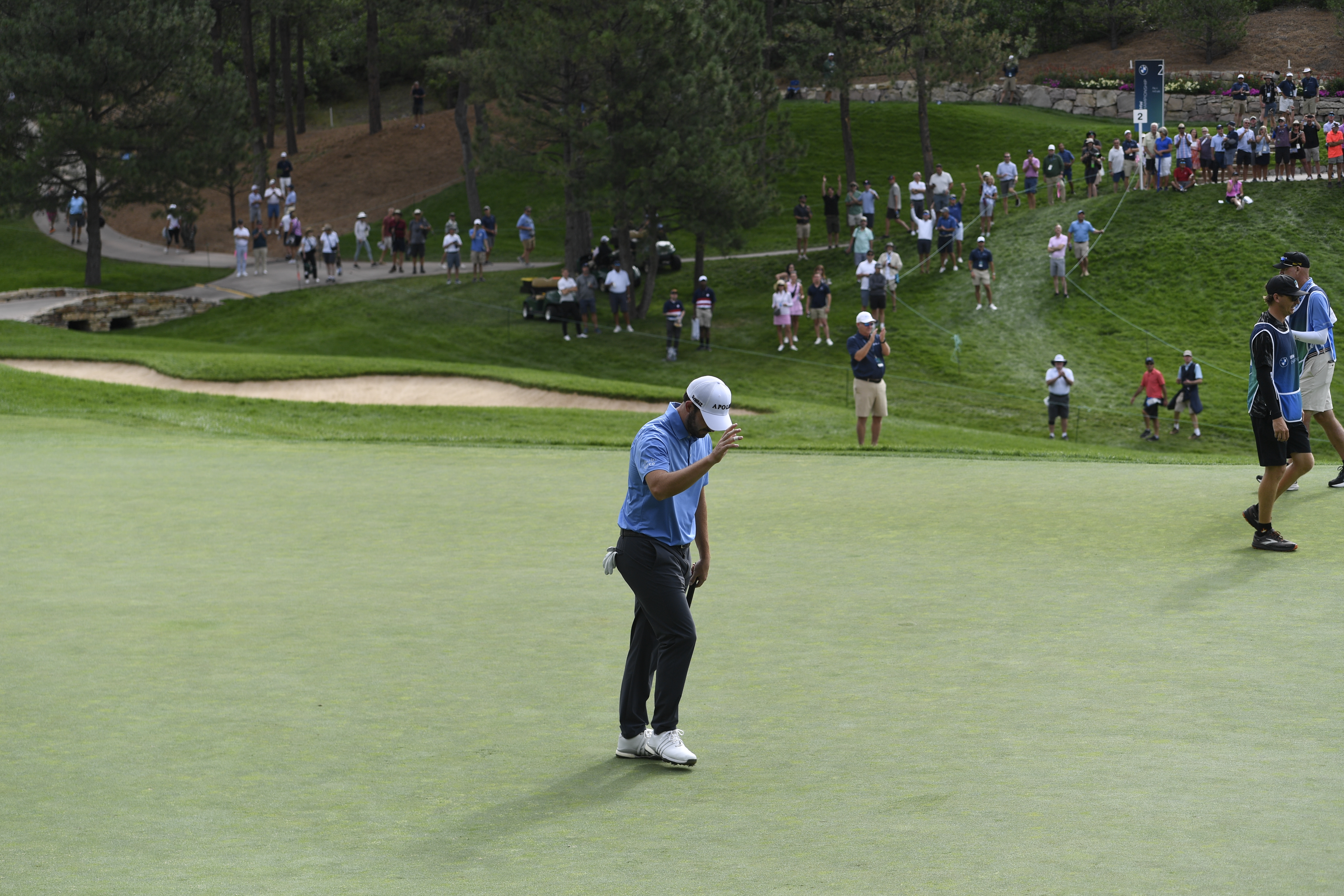 Patrick Cantlay celebrates after putting for eagle at Castle Pines Golf Club during the first round of the BMW Championship on Thursday, Aug. 22, 2024. (CarsonFieldcarson.field@gazette.comhttps://secure.gravatar.com/avatar/c524ef3d384945349bed78d70eb2d2cd?d=mm&r=g)