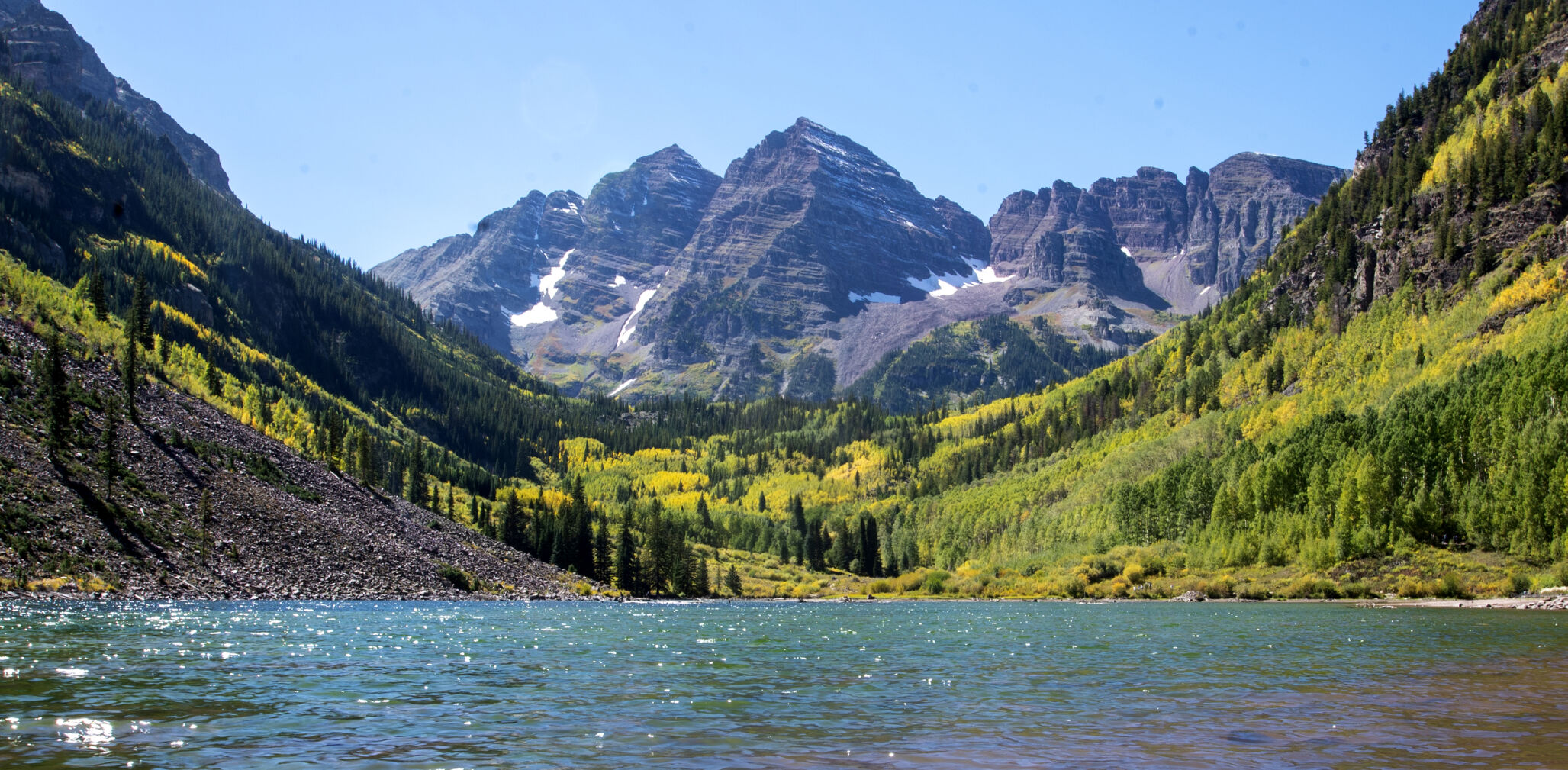 As the first bits of snow cover Maroon Peak, aspen groves in the foreground start showing their fall colors at Maroon Bells northwest of Aspen on Sept. 22. (The Gazette, Jon Mitchell)
