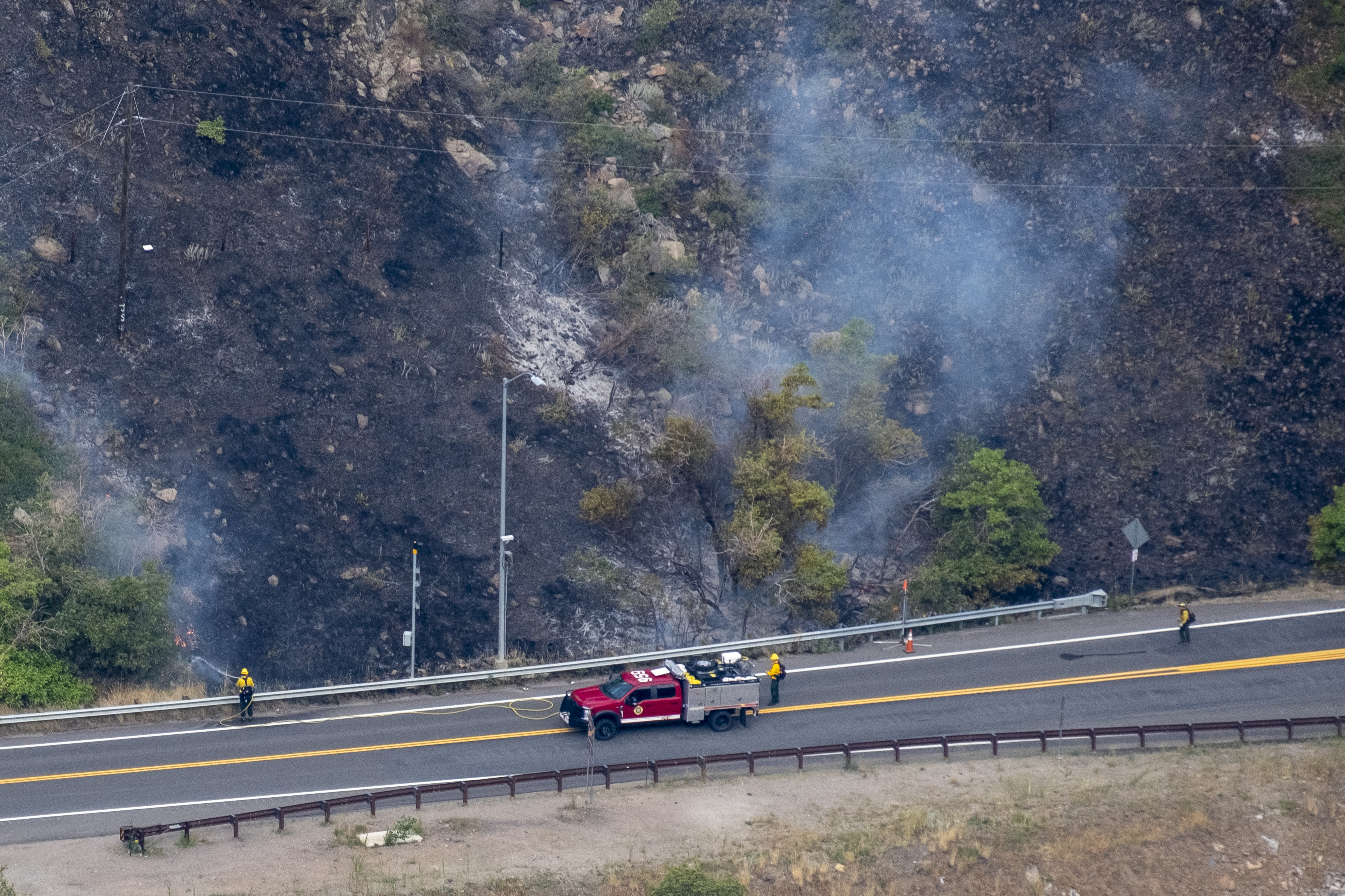 A firefighter sprays water onto a wildfire burning shrub brush near US Hwy 6 around Tunnel 1 in Clear Creek Canyon Wednesday, Aug. 21, 2024. The wildfire started Tuesday, Aug. 20 from a lightning strike during an afternoon thunderstorm. (JonathanIngrahamDigital Strategistjonathan.ingraham@denvergazette.comhttps://denvergazette.com/content/tncms/avatars/c/dd/7f0/cdd7f086-b693-11ec-b373-bba598953eb6.fc0f5608a6f1144f64f080f771bd904d.png)