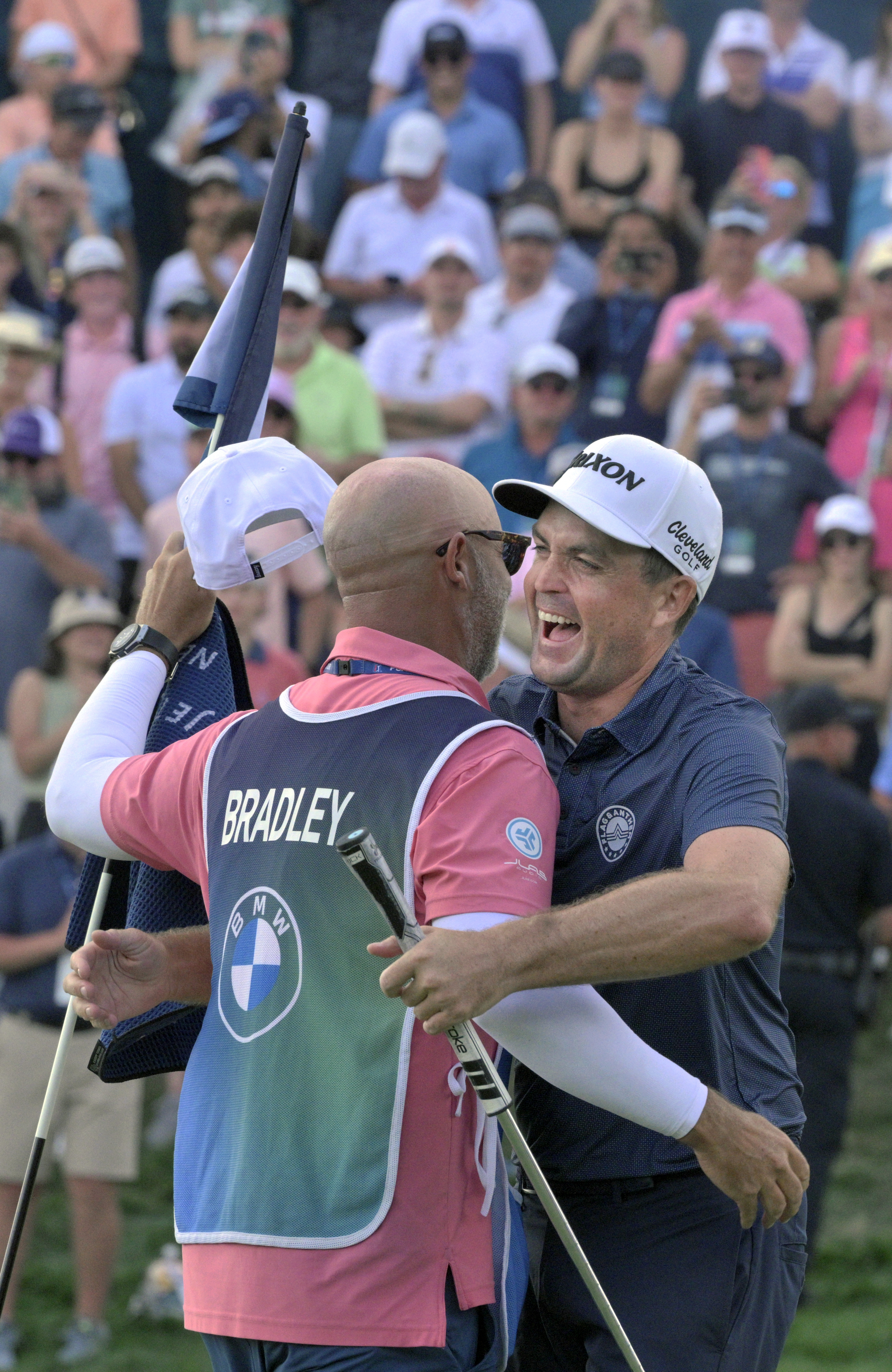 Keegan Bradley hugs his caddy Scott Vail after winning the 2024 BMW Championship on Sunday, August 25, 2024. Bradley won the competition with a score of 12 under.