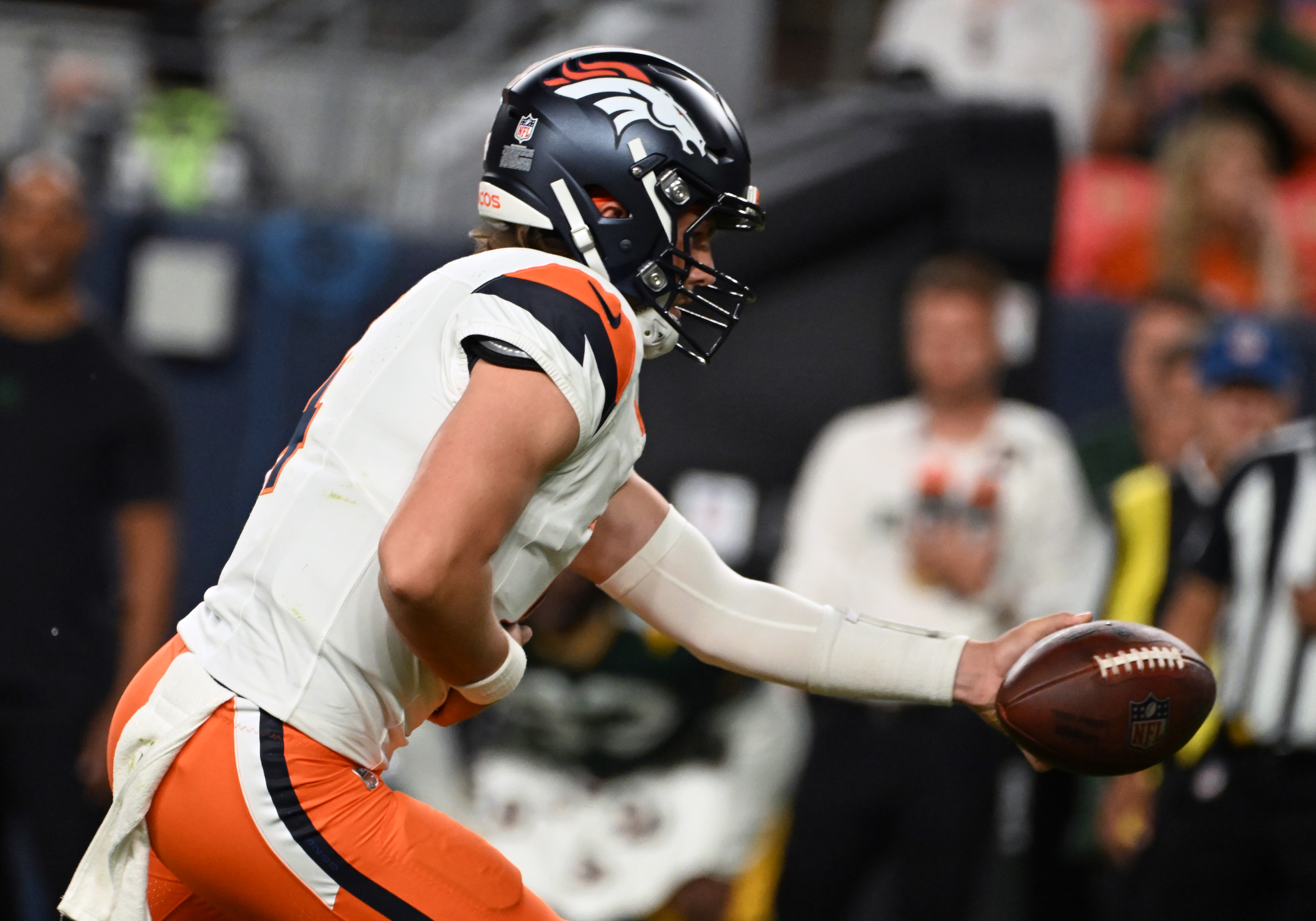 Broncos quarterback Zach Wilson gets ready to hand off the ball during the fourth quarter a preseason game against the Packers on Sunday, Aug. 18, 2024. The Broncos won the game 28-2. (Jerilee Bennett The Gazette)