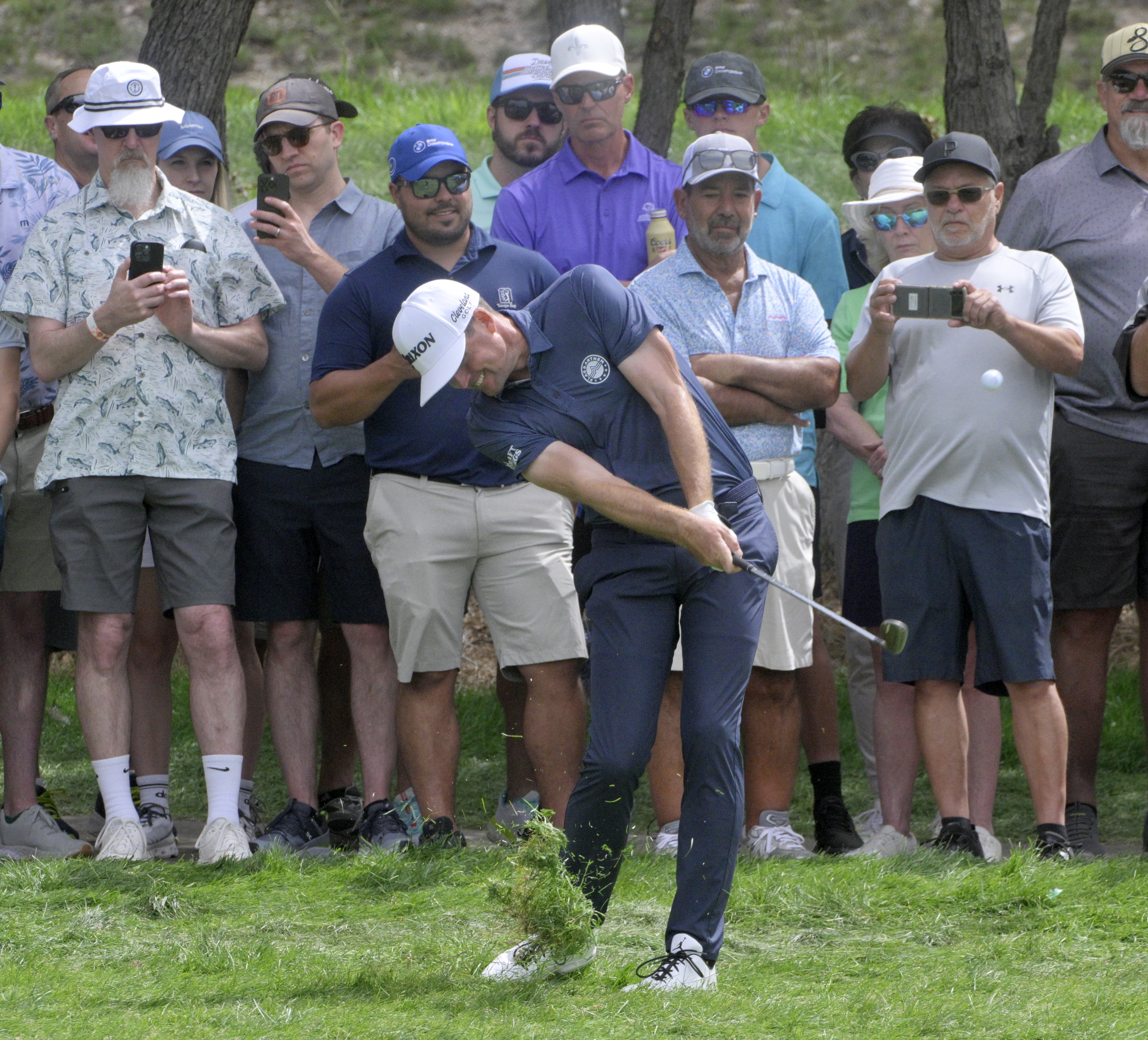 Keegan Bradley hits next to the crowd along fairway for hole 2 during the final day of the 2024 BMW Championship on Sunday, August 25, 2024. Bradley won the competition with a score of 12 under.