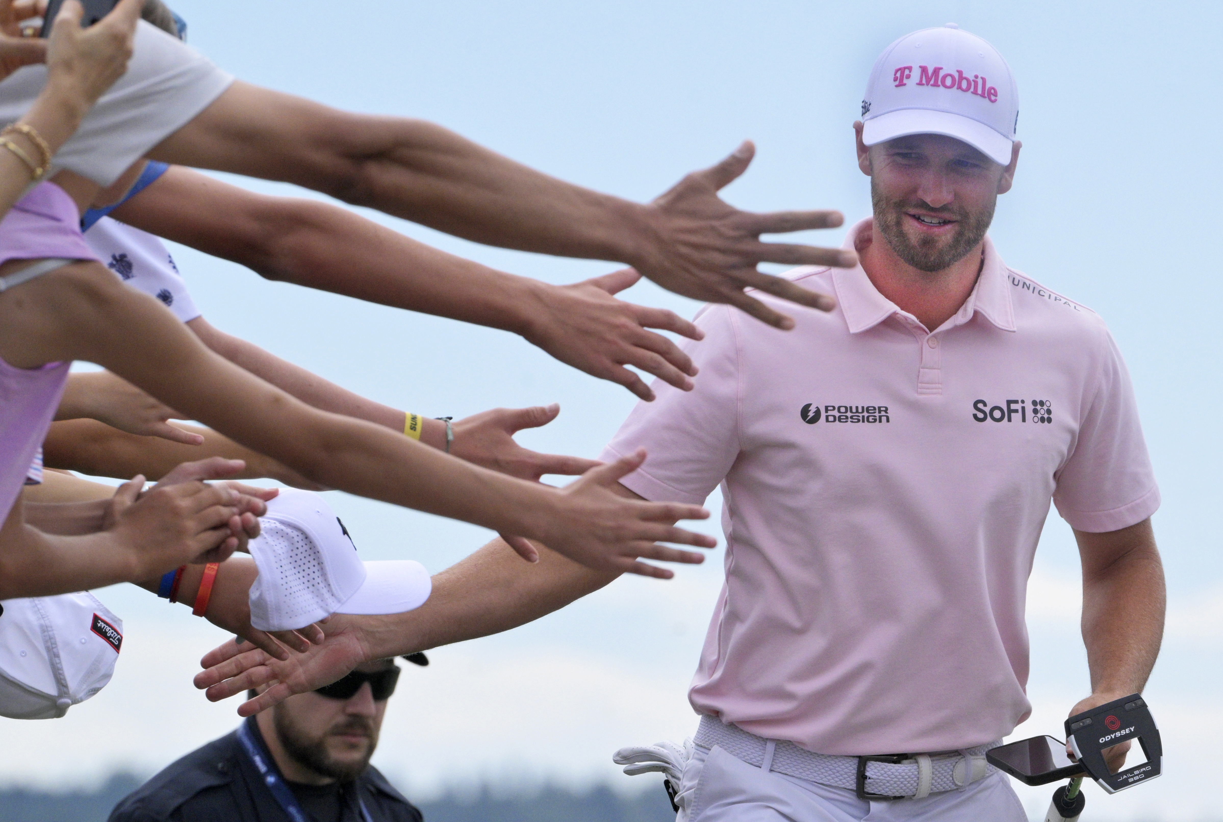 Wyndham Clark 2024 slaps hands with the crowd as he approaches the first tee at the BMW Championship on Sunday, August 25, 2024.