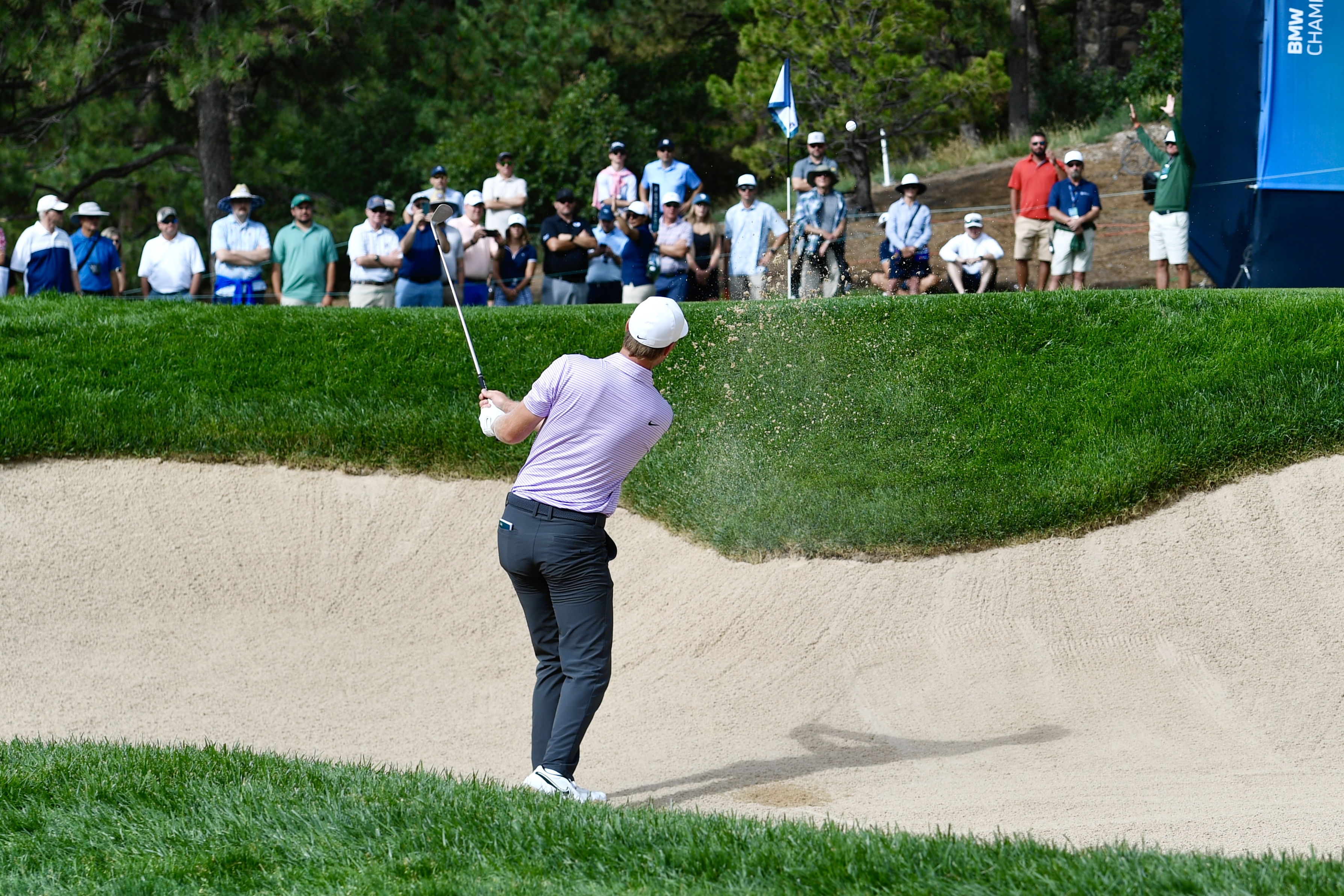 Cam Davis hits from the bunker at Castle Pines Golf Club during the first round of the BMW Championship on Thursday, Aug. 22, 2024. (CarsonFieldcarson.field@gazette.comhttps://secure.gravatar.com/avatar/c524ef3d384945349bed78d70eb2d2cd?d=mm&r=g)