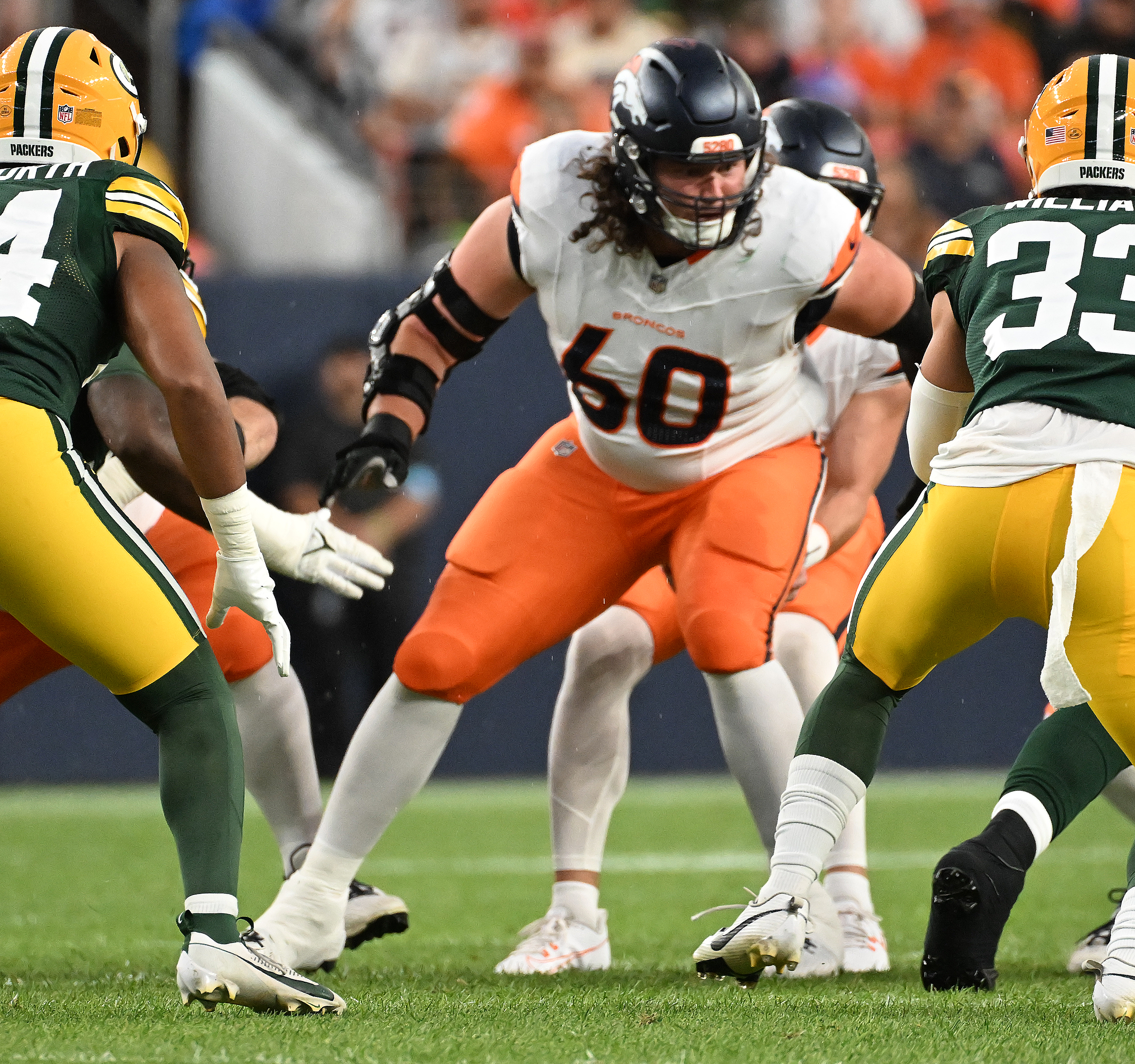 Denver Broncos center Luke Wattenberg (60) is in on a play during a preseason game against the Packers on Sunday, Aug. 18, 2024. The Broncos won the game 27-2. (Jerilee Bennett, The Gazette)