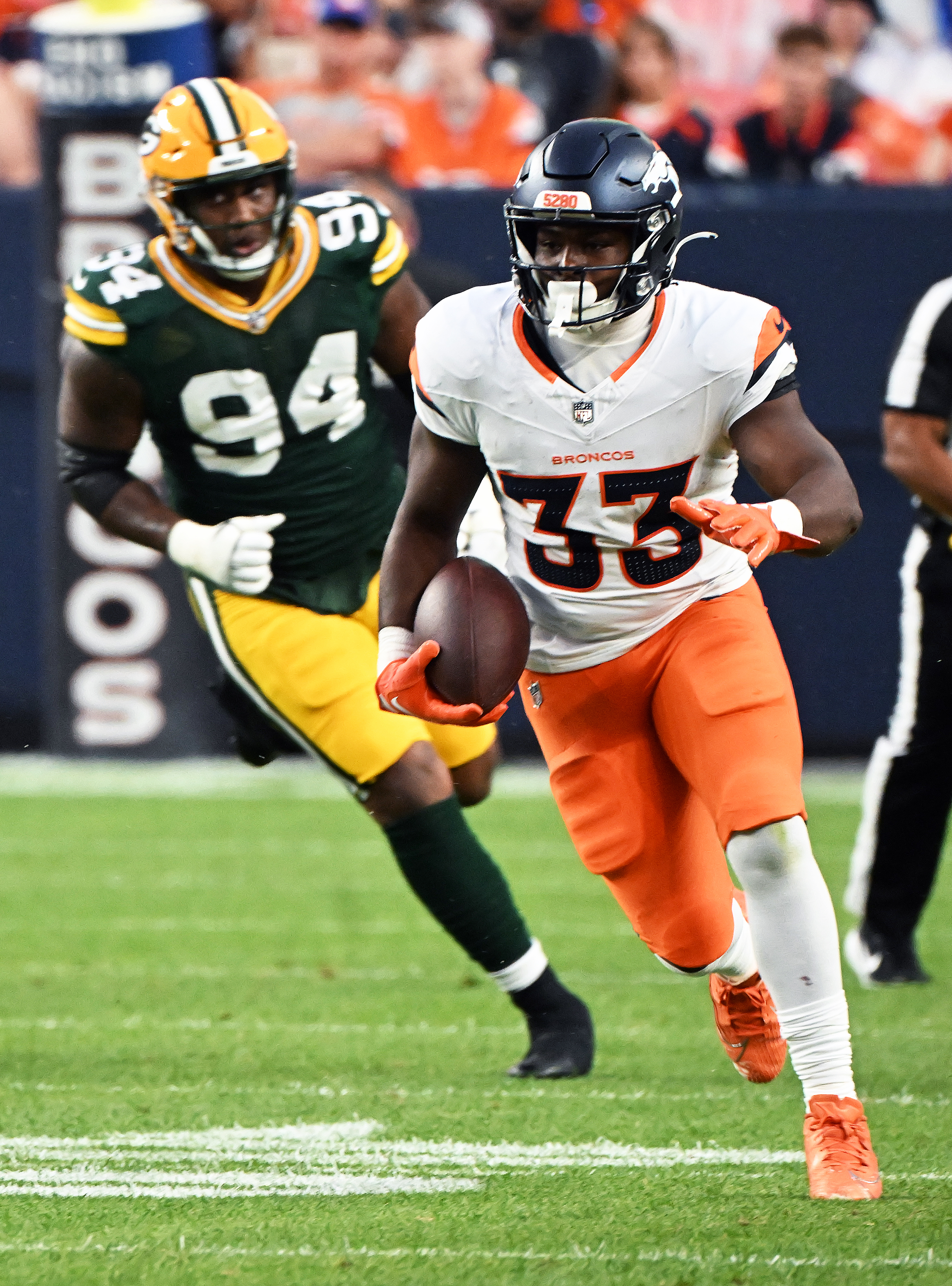 Broncos running back Javonte Williams runs with the ball during the first quarter of a preseason game against the Packers on Sunday, Aug. 18, 2024. (Jerilee Bennett The Gazette)