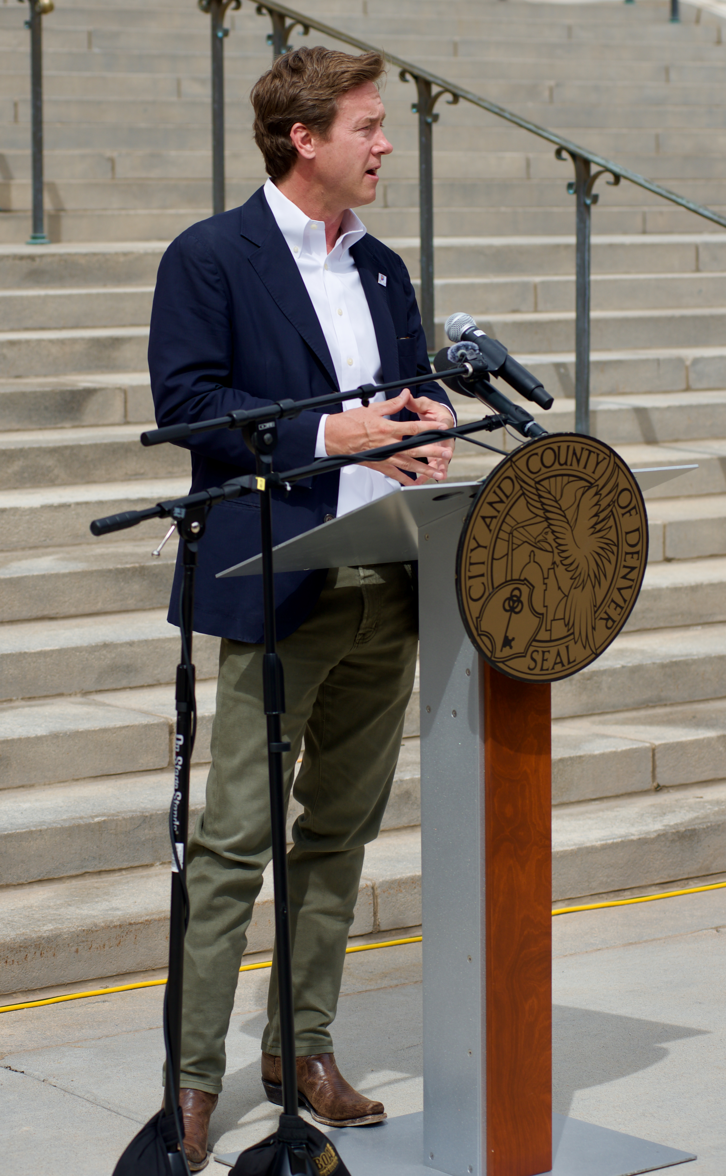 FILE PHOTO: Denver Mayor Mike Johnston addresses a crowd from a podium on Monday, August 26, 2024. (AlexanderEdwardsBusiness Reporteralex.edwards@gazette.comhttps://secure.gravatar.com/avatar/dbaa50cc8a9183e280c297e3afa72ace?d=mm&r=g)