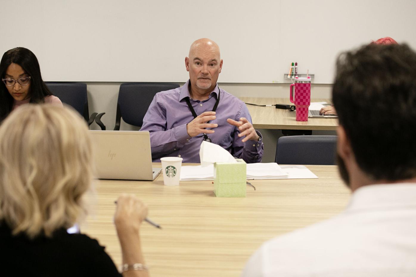 General Manager of Aurora Water, Marshall Brown, center, addresses Aurora City
