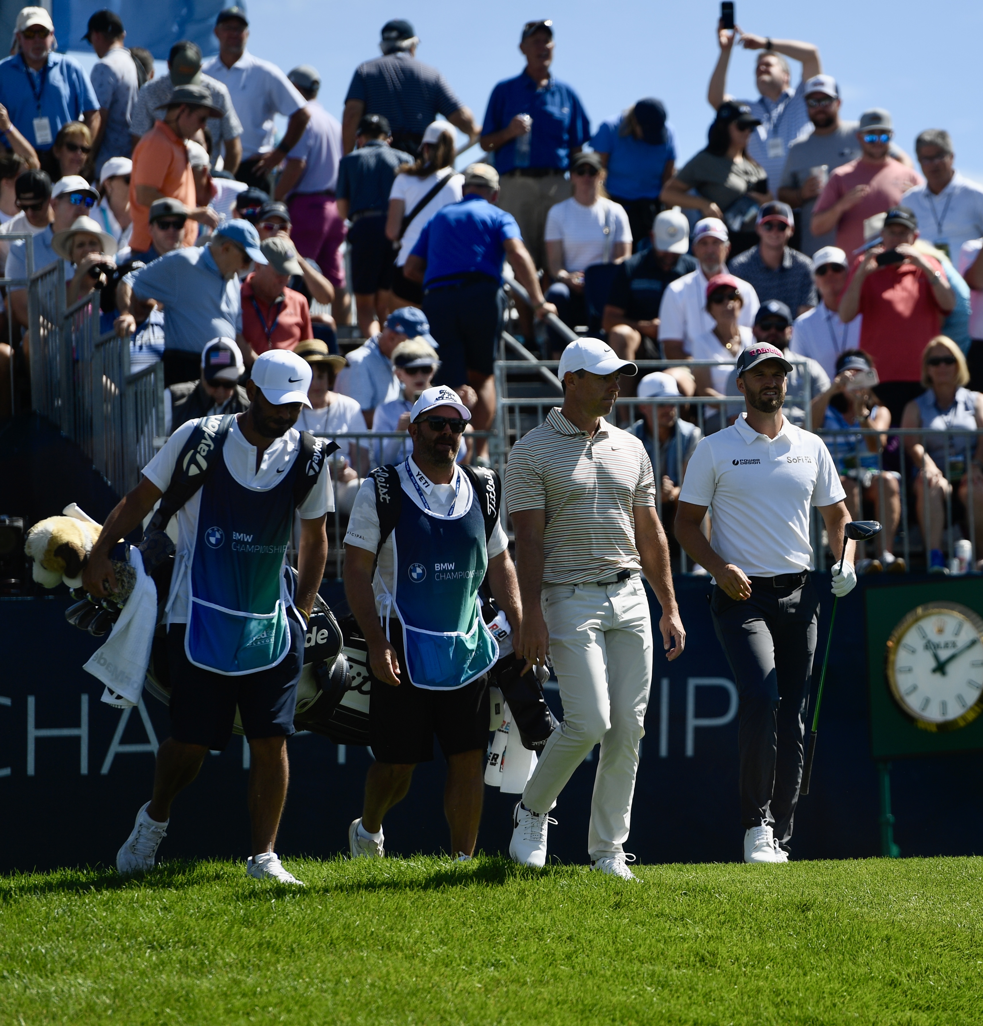 Wyndham Clark (right) and Rory McIlroy walk off the first tee at Castle Pines Golf Club during the first round of the BMW Championship on Thursday, Aug. 22, 2024. (CarsonFieldcarson.field@gazette.comhttps://secure.gravatar.com/avatar/c524ef3d384945349bed78d70eb2d2cd?d=mm&r=g)