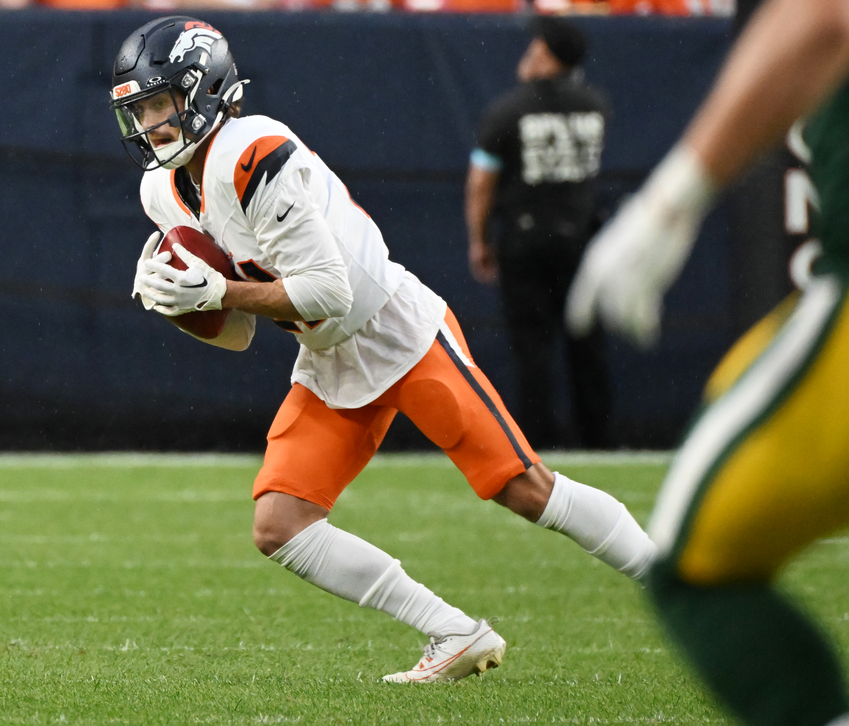Denver Broncos cornerback Riley Moss (21) runs a punt during a preseason game against the Packers on Sunday, Aug. 18, 2024. The Broncos won the game 27-2. (Jerilee Bennett, The Gazette)