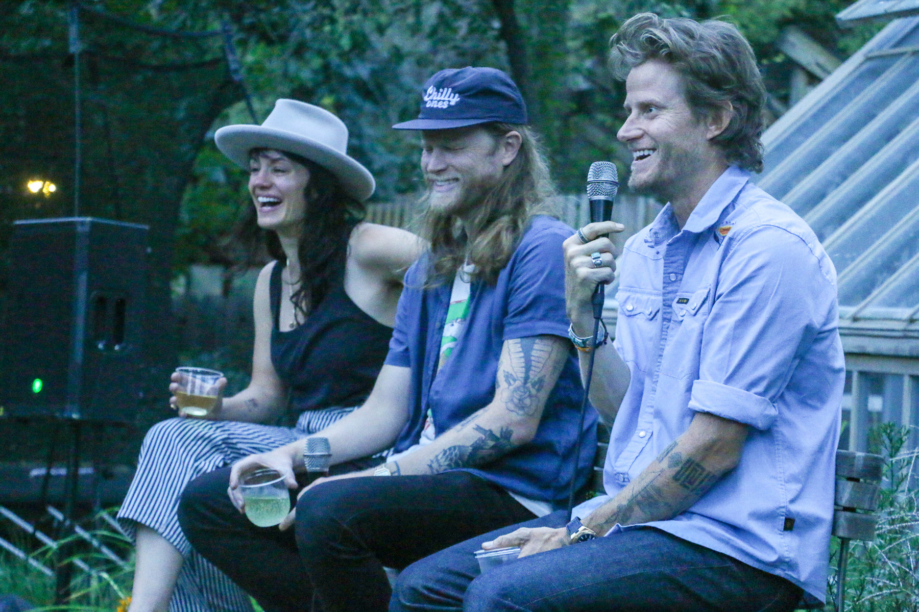 Brandy and Wesley Schultz, left, invited friends to gather in their backyard for a garden party and book launch for friend Cory Richards' new memoir