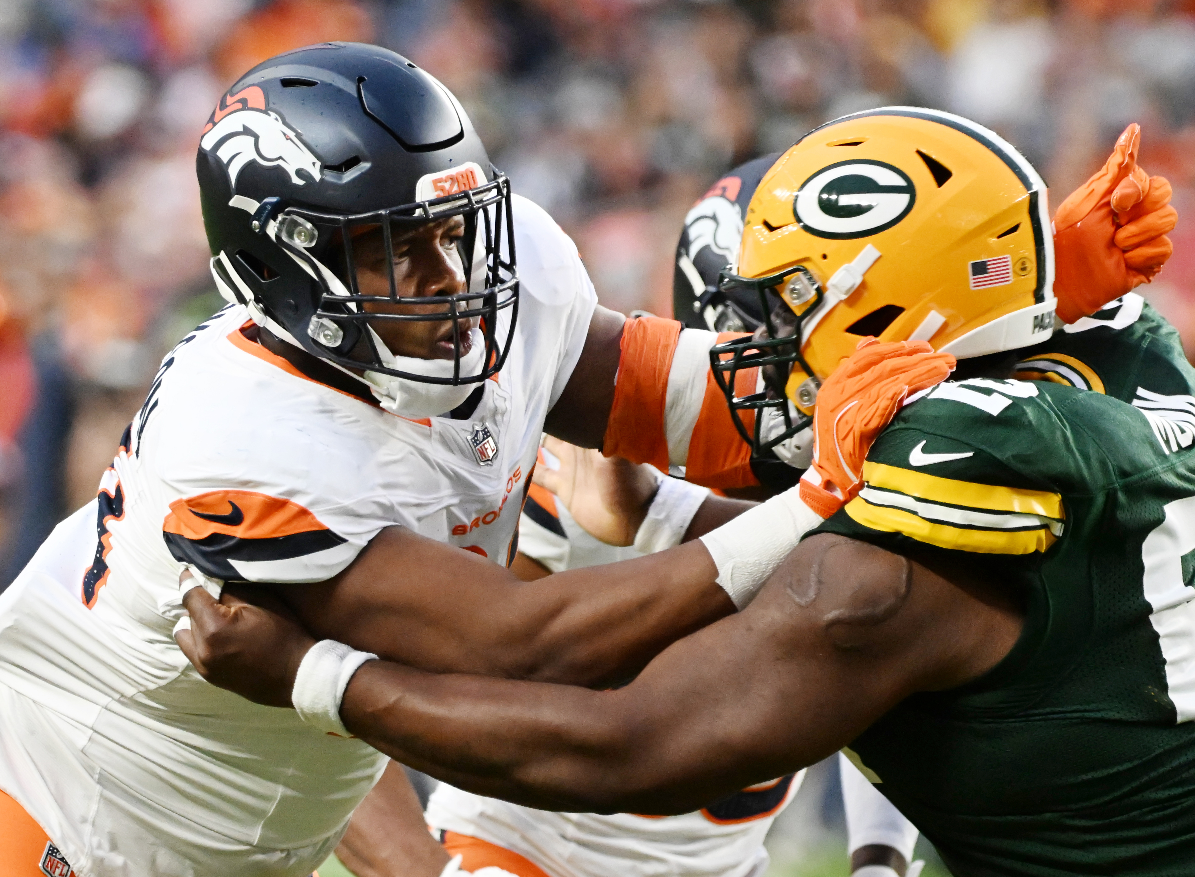 Broncos defensive lineman Jordan Jackson, and former Air Force player, defends a Packer during the second quarter of a preseason game against the Packers on Sunday, Aug. 18, 2024. (Jerilee Bennett, The Gazette)