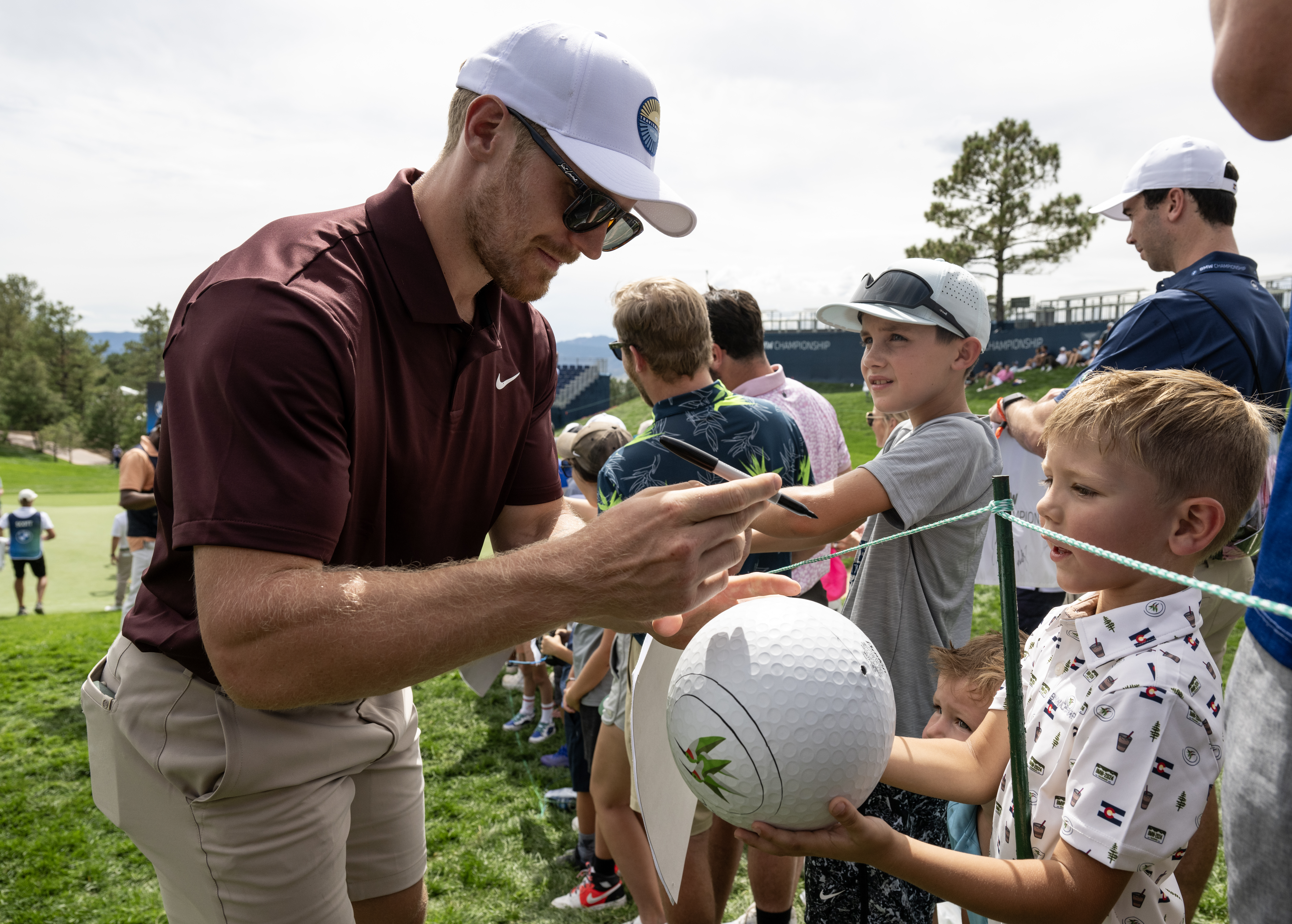 Colorado Avalanche left wing Gabriel Landeskog signs an autograph for five-year-old Brody Watson during the Gardner Heidrick Pro-Am at Castle Pines Golf Club in Castle Rock, Colo., on Wednesday, Aug. 21, 2024. (Parker Seibold, The Gazette) (Parker Seibold, The Gazette)