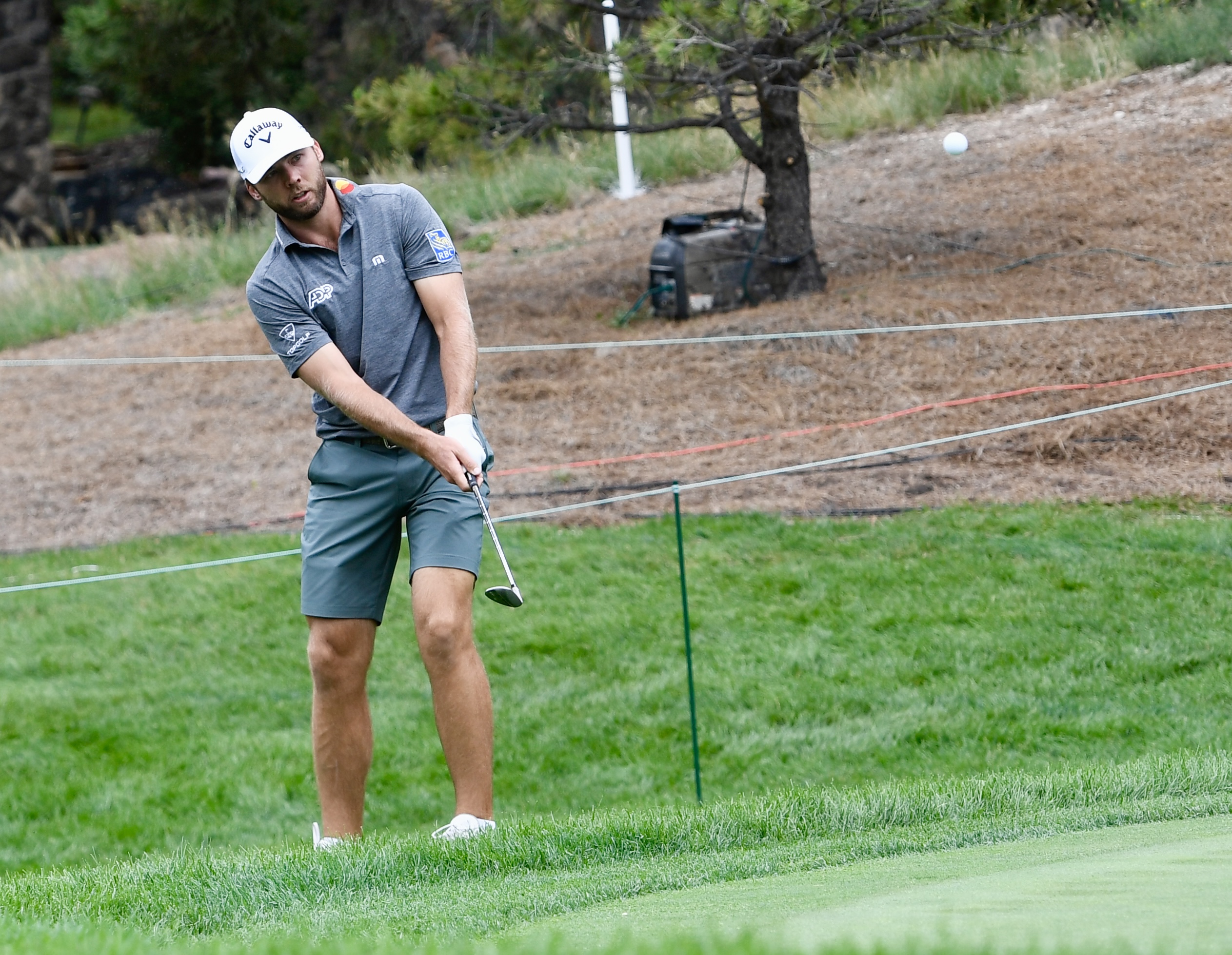 Sam Burns chips onto the first green at Castle Pines Golf Club at Wednesday's BMW Championship pro-am on Aug. 21, 2024. (CarsonFieldcarson.field@gazette.comhttps://secure.gravatar.com/avatar/c524ef3d384945349bed78d70eb2d2cd?d=mm&r=g)