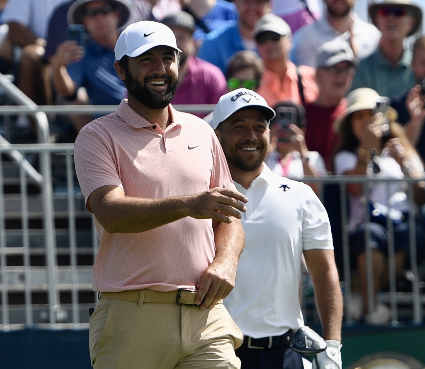 Scottie Scheffler and Xander Schauffele smile while walking off the first tee at Castle Pines Golf Club during the second round of the BMW Championship on Friday, Aug. 23, 2024. (CarsonFieldcarson.field@gazette.comhttps://secure.gravatar.com/avatar/c524ef3d384945349bed78d70eb2d2cd?d=mm&r=g)