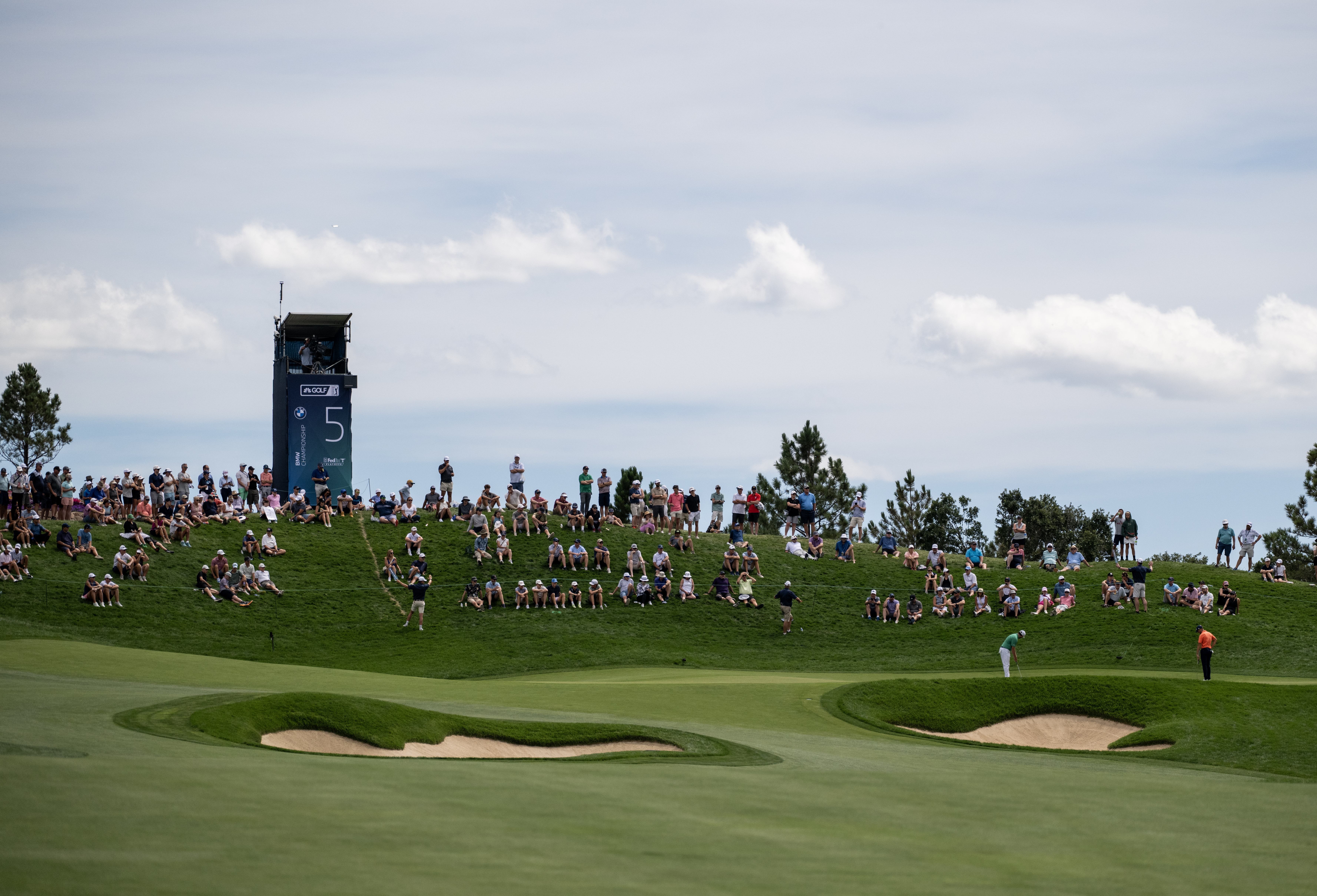 Fans watch Patrick Cantlay and Wyndham Clark putt on the 5th hole in the third round of the BMW Championship at Castle Pines Golf Club, Saturday, Aug. 24, 2024, in Castle Rock, Colo. (Parker Seibold, The Gazette) (Parker Seibold, The Gazette)