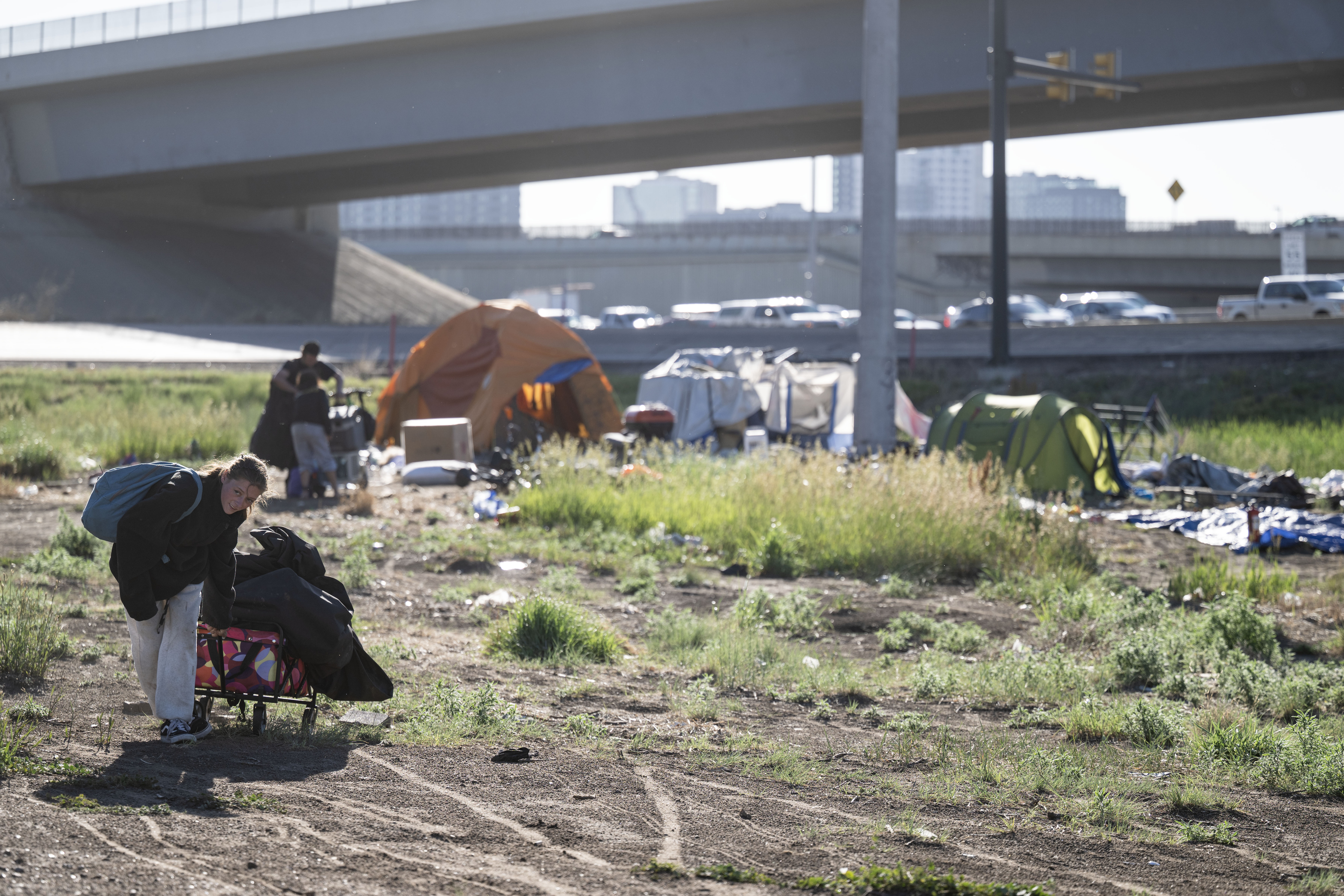 Hannah Haight, left, and Daniel Teitsort gather as many of their belongings as they can before the city comes through during a sweep of the encampment in Denver on Thursday, June 13, 2024. (StephenSwoffordPhotographerstephen.swofford@gazette.comhttps://secure.gravatar.com/avatar/1ddcaf11c5d70eaa58546ddc4e038687?d=mm&r=g)