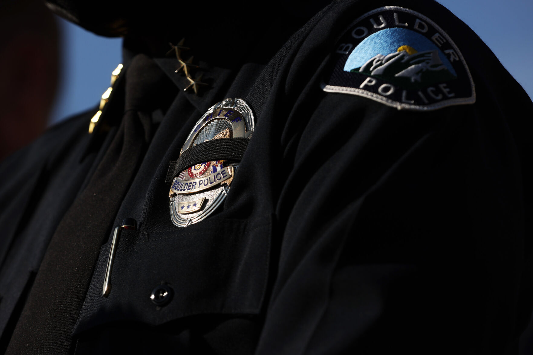 Boulder Police Chief Maris Herold wears a black stripe over her police badge while speaking at a press conference in Boulder on March 23, 2021. A gunman killed 10 people, including officer Eric Talley, in a mass shooting in town the day before. (Forrest Czarnecki/The Gazette) (Forrest Czarnecki)