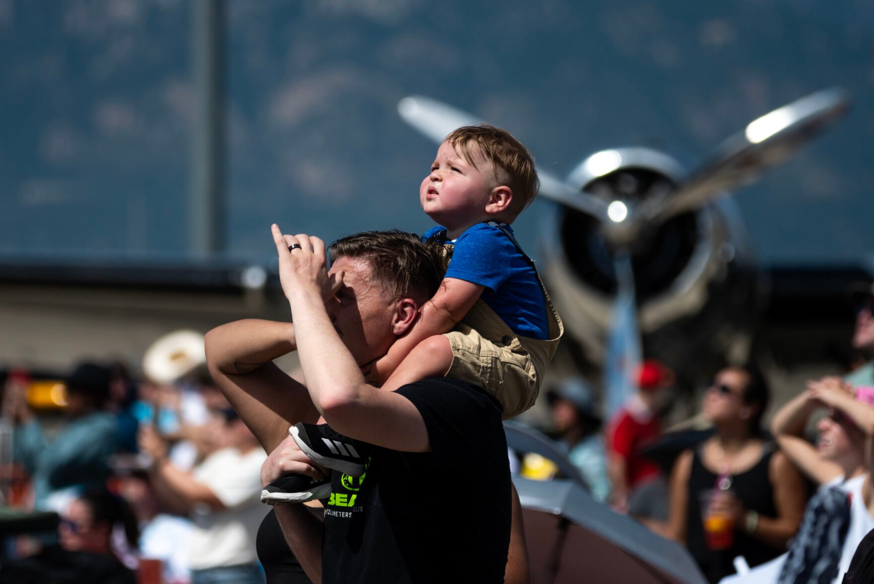 Nathan McCrary, 1, sits on his dad Patrick McCrary’s shoulders at the Pikes Peak Regional Airshow at the Colorado Springs Airport on Saturday, Aug. 17, 2024. (Parker Seibold, The Gazette) (Parker Seibold The Gazette)