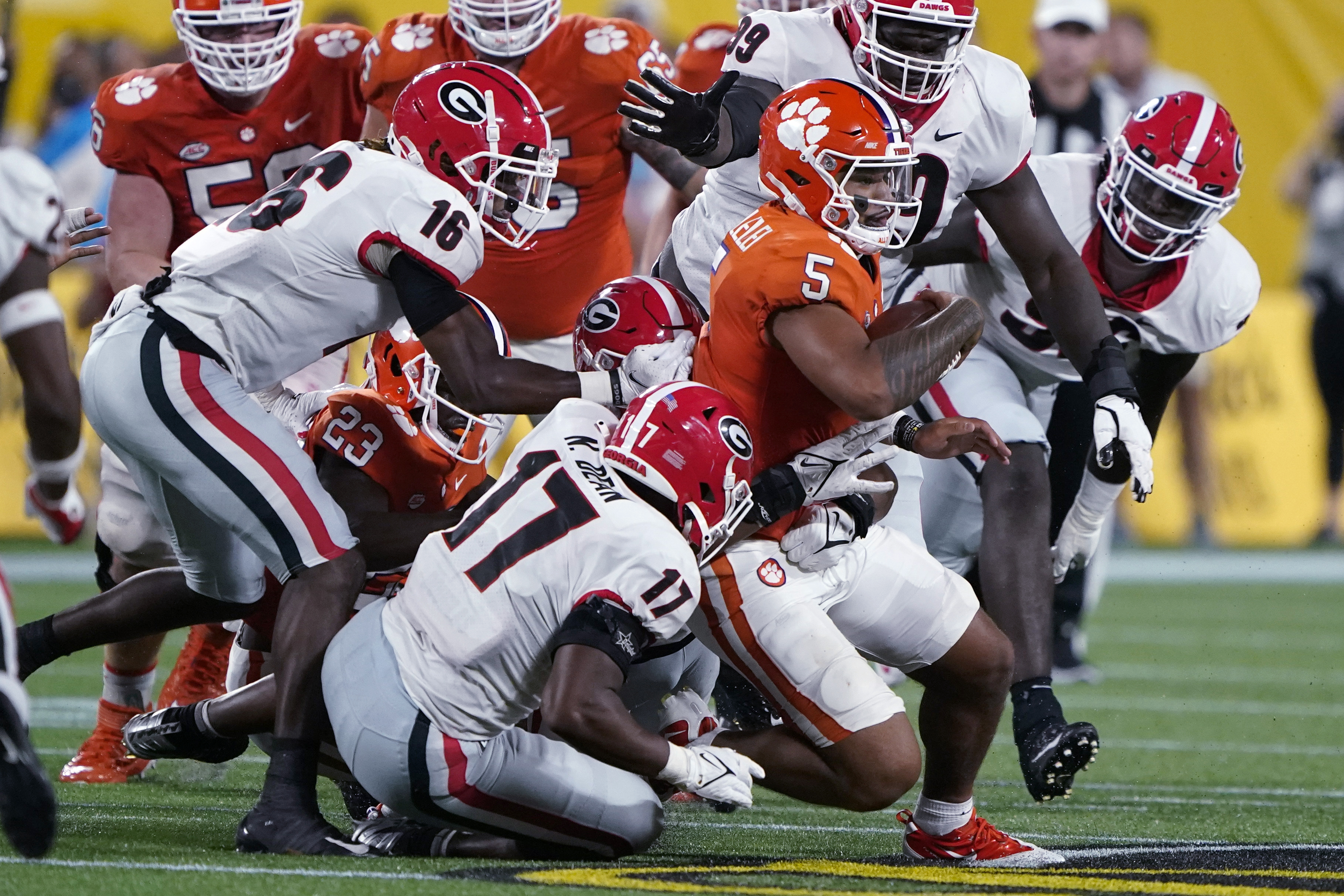 Clemson quarterback D.J. Uiagalelei is tackled by Georgia defenders during the second half of an NCAA college football game Saturday, Sept. 4, 2021, in Charlotte, N.C. (AP Photo/Chris Carlson) (Chris Carlson)