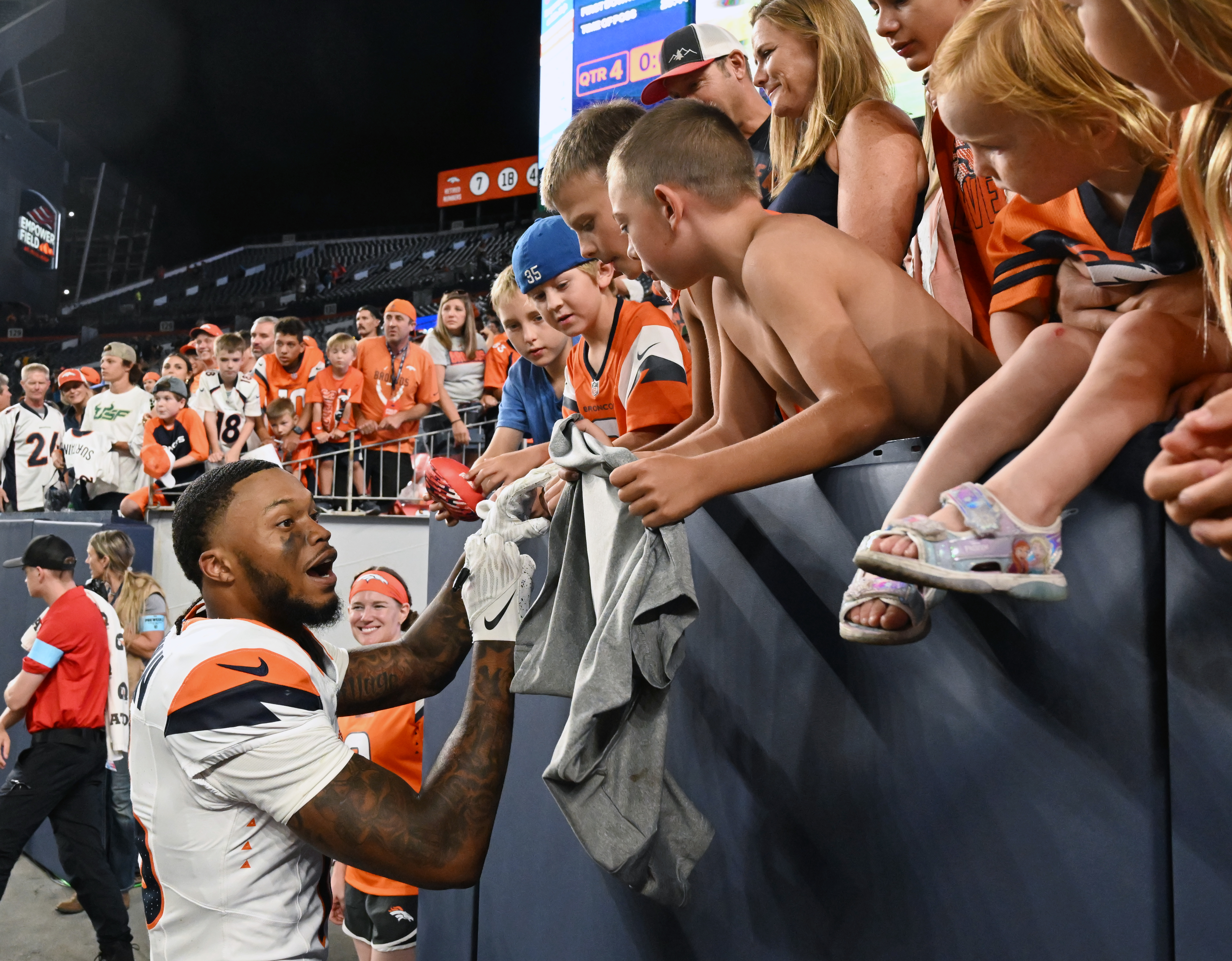 Broncos rookie wide receiver Troy Franklin signs autographs after a preseason game against the Packers on Sunday, Aug. 18, 2024. The Broncos won the game 28-2. (Jerilee Bennett The Gazette)