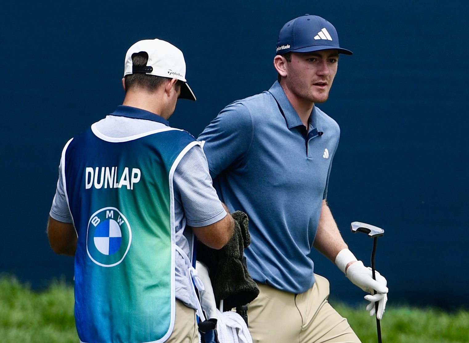Nick Dunlap hands a club to his caddy at Castle Pines Golf Club during the second round of the BMW Championship on Friday, Aug. 23, 2024. (CarsonFieldcarson.field@gazette.comhttps://secure.gravatar.com/avatar/c524ef3d384945349bed78d70eb2d2cd?d=mm&r=g)