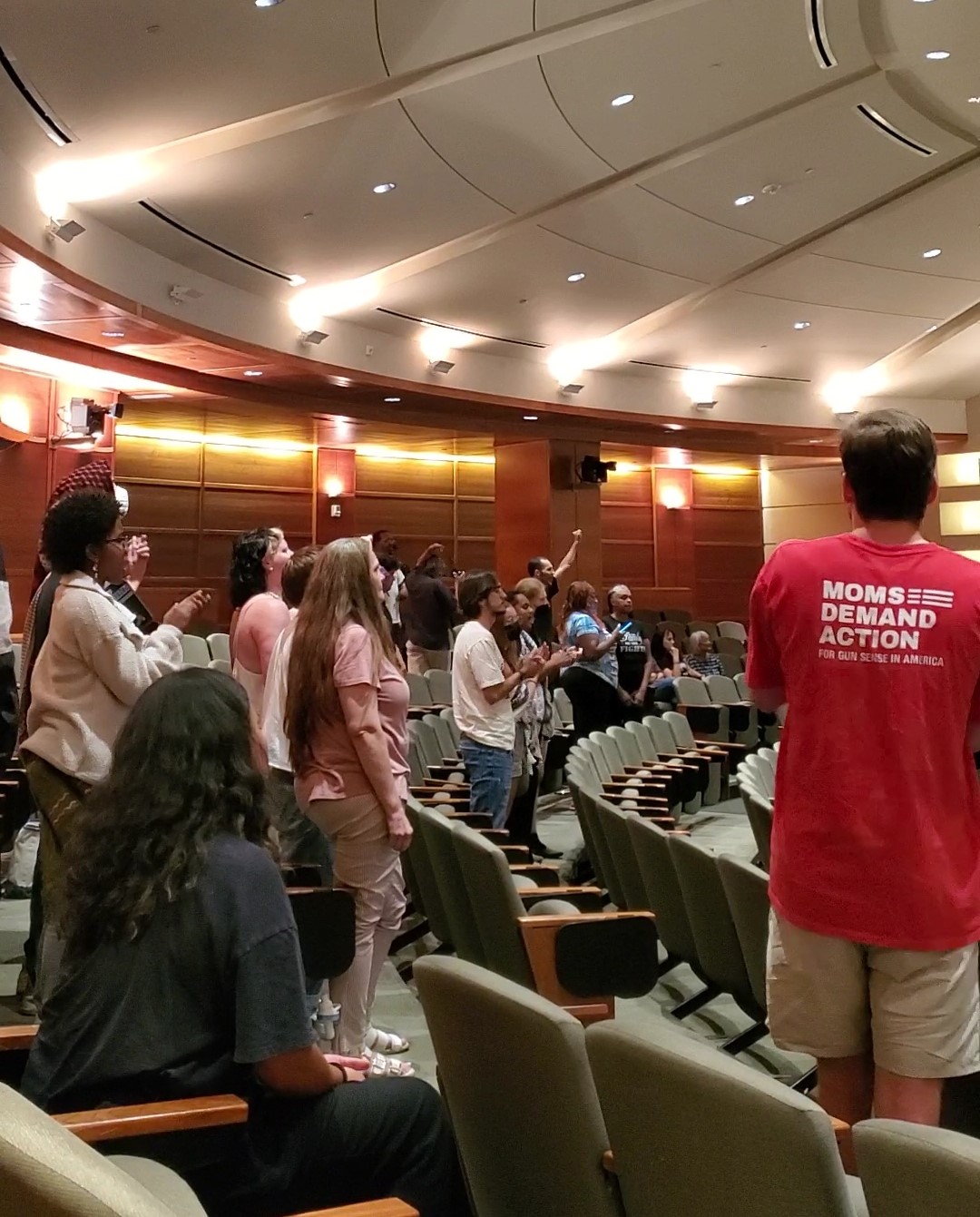 Activists disrupt the Aurora City Council Meeting on Aug. 26, 2024, after councilmembers approved Todd Chamberlain as the new police chief for the Aurora Police Department. (Anya Moore)
