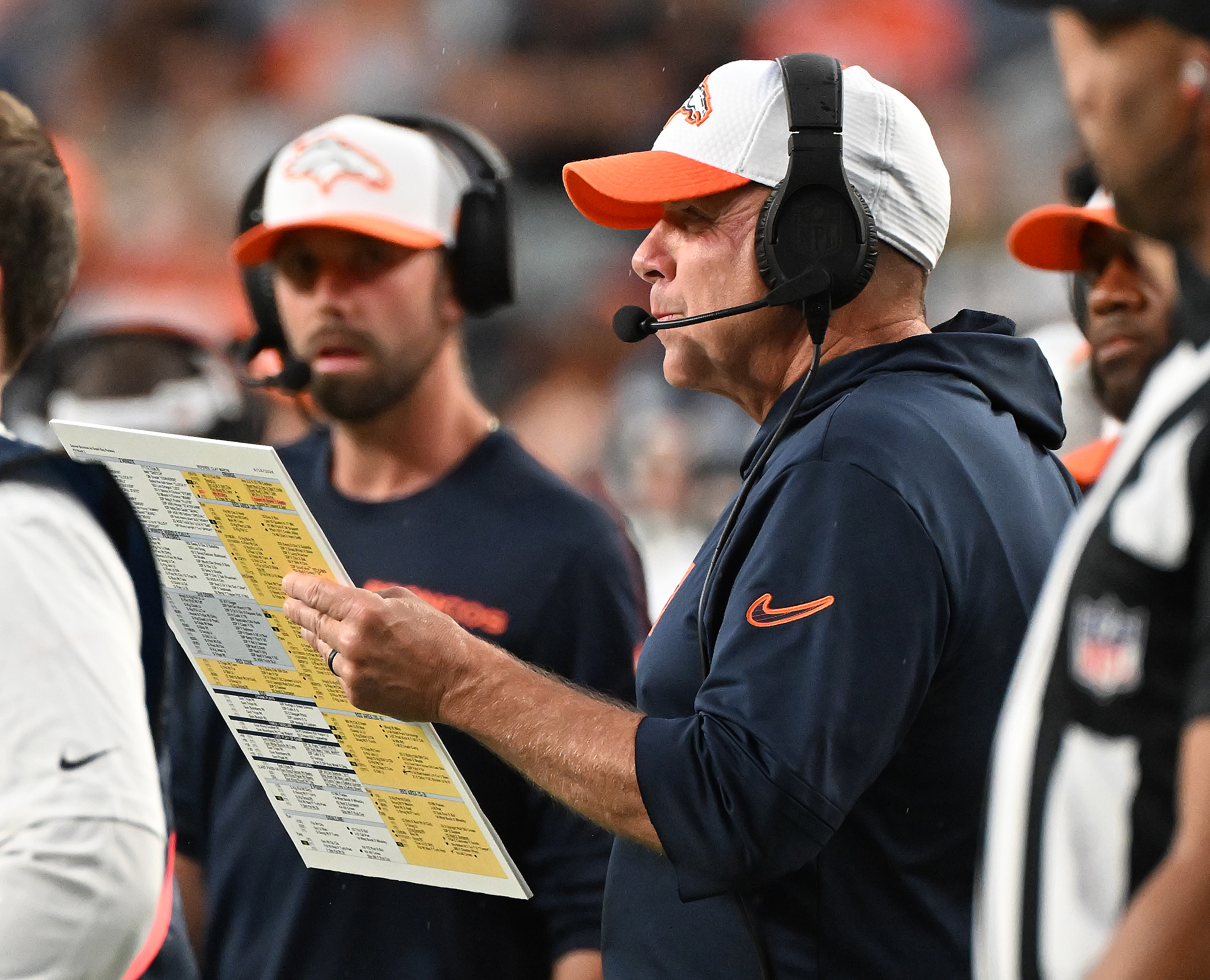 Broncos Head Coach Sean Payton looks over some plays during the first quarter of a preseason game against the Packers on Sunday, Aug. 18, 2024. (Jerilee Bennett The Gazette)