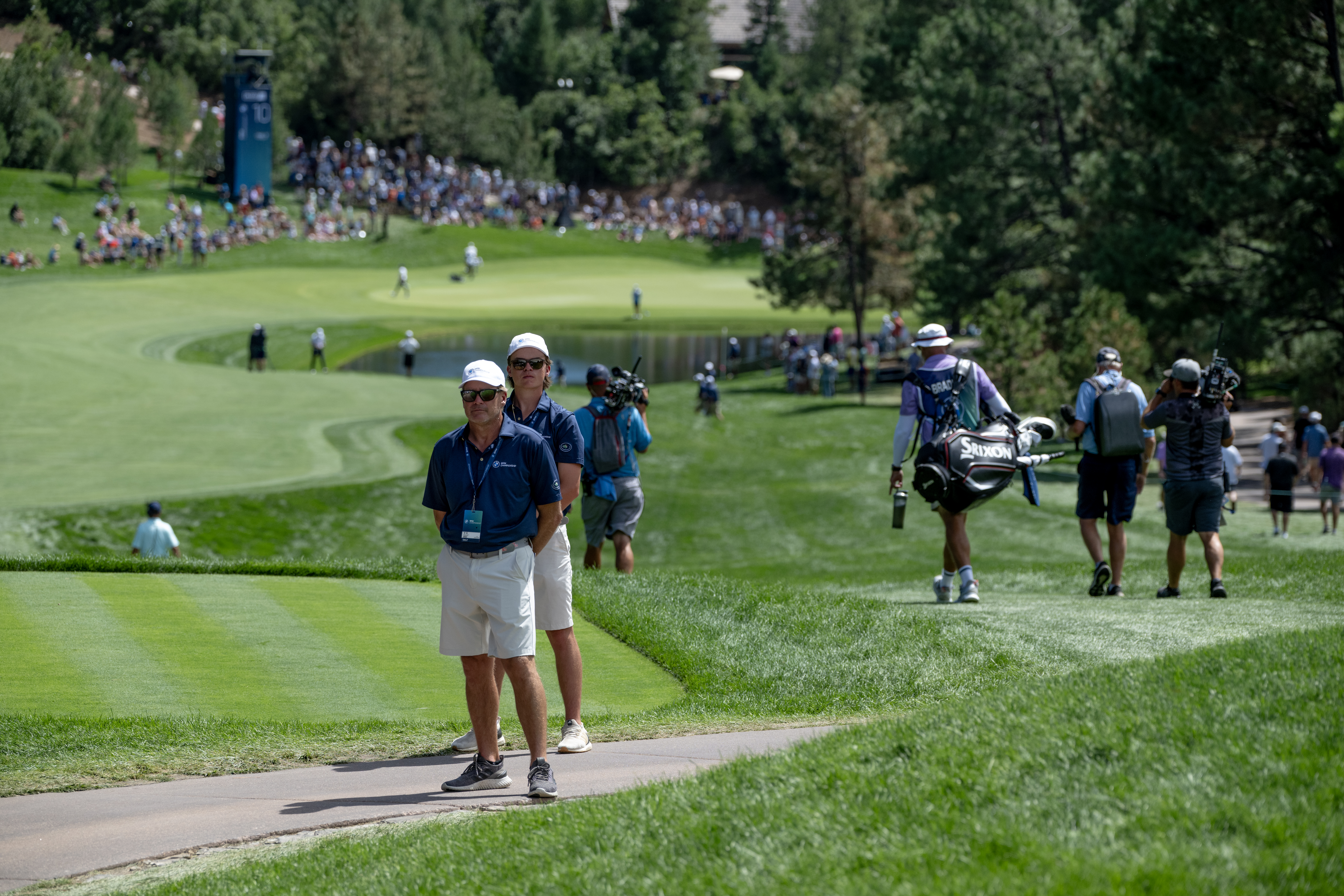 Father-son duo Todd and Connor Moberly stop foot traffic as golfers walk down the fairway at the third round of the BMW Championship at Castle Pines Golf Club, Saturday, Aug. 24, 2024, in Castle Rock, Colo. (Parker Seibold, The Gazette) (Parker Seibold, The Gazette)