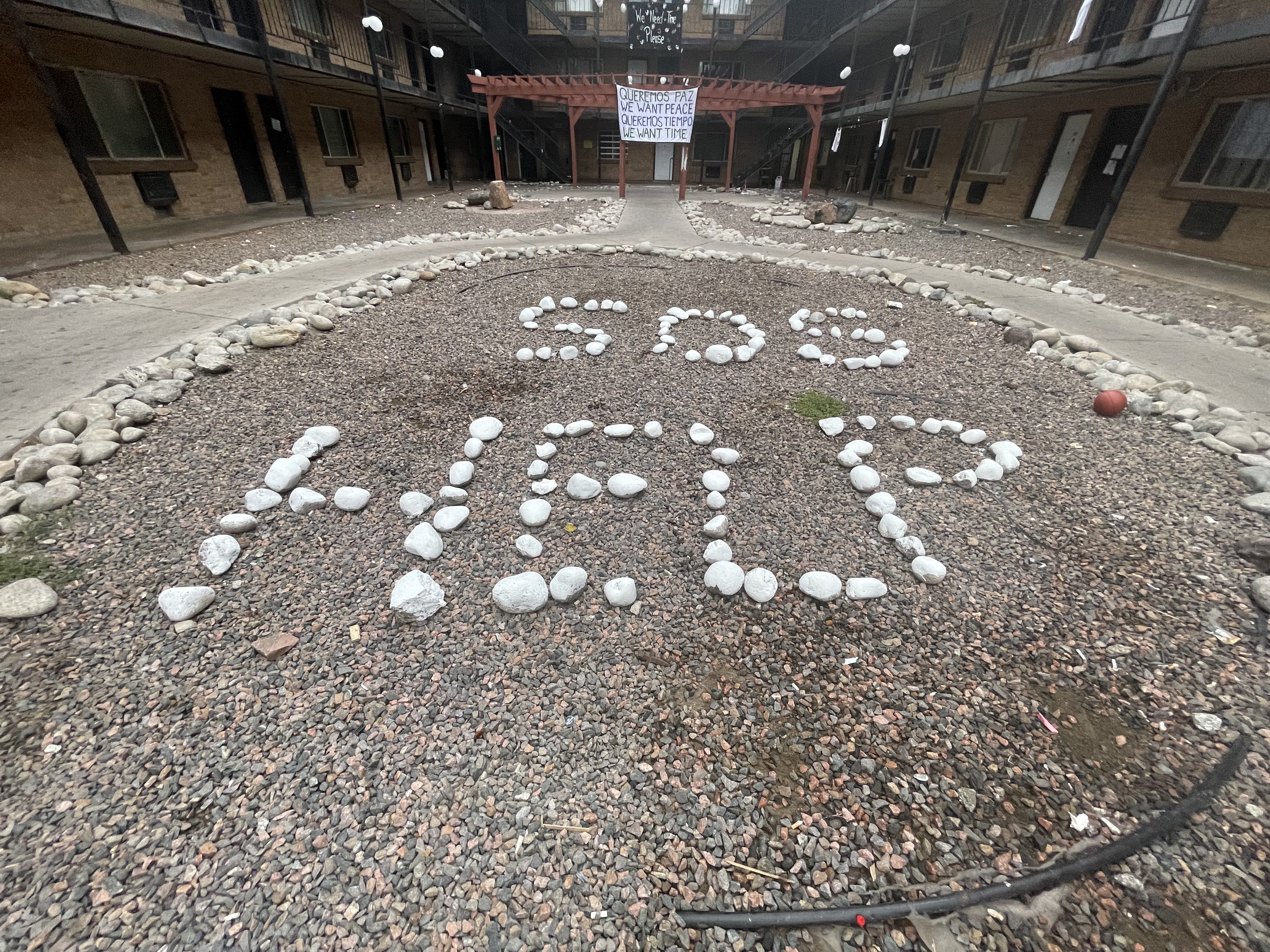 FILE PHOTO: A message in the plaza area of the Aspen Grove apartments spelled out in white rocks spell 