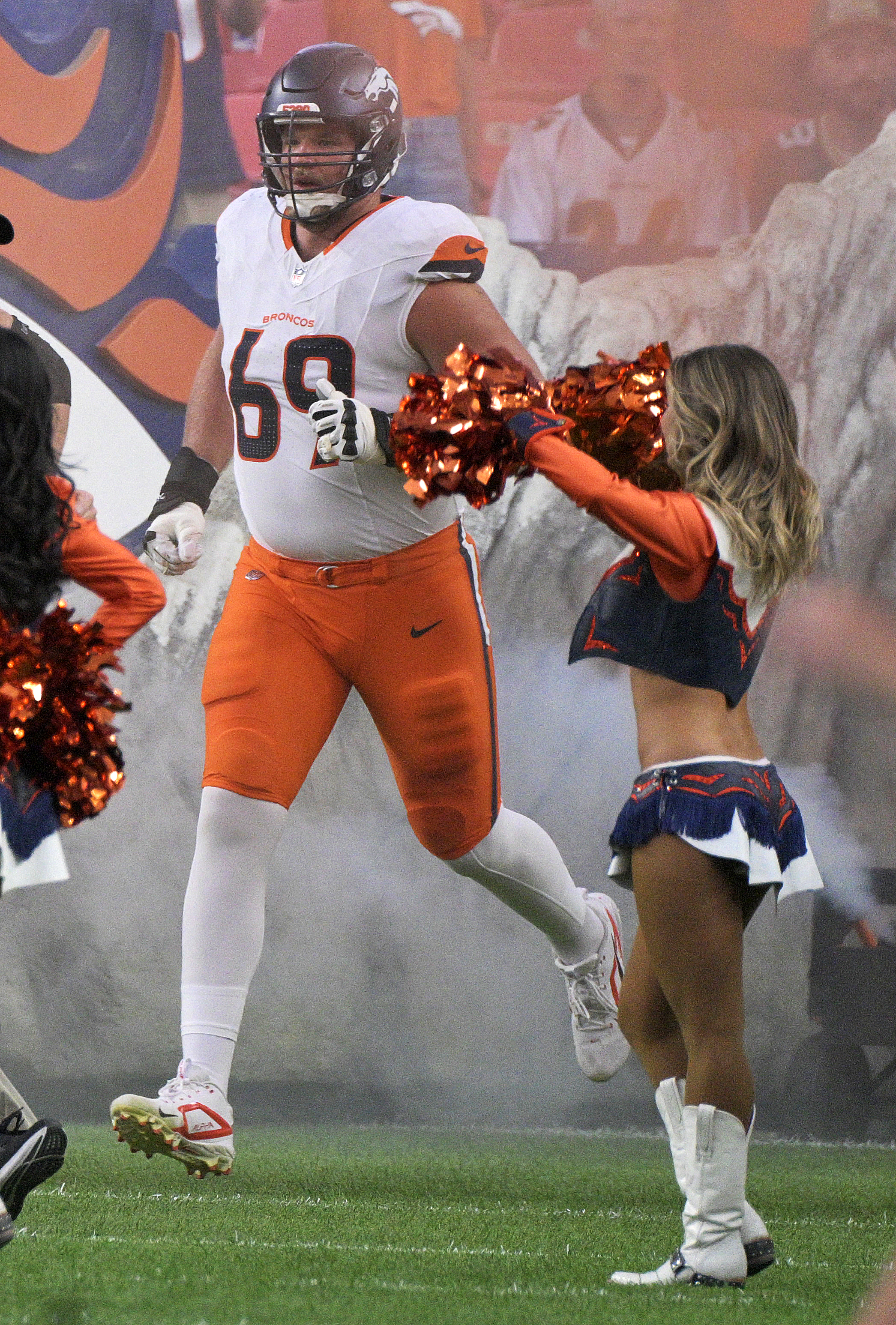 Denver Broncos offensive tackle Mike McGlinchey (69) takes the field before a preseason game against the Packers on Sunday, Aug. 18, 2024. The Broncos won the game 27-2. (Jerilee Bennett, The Gazette)