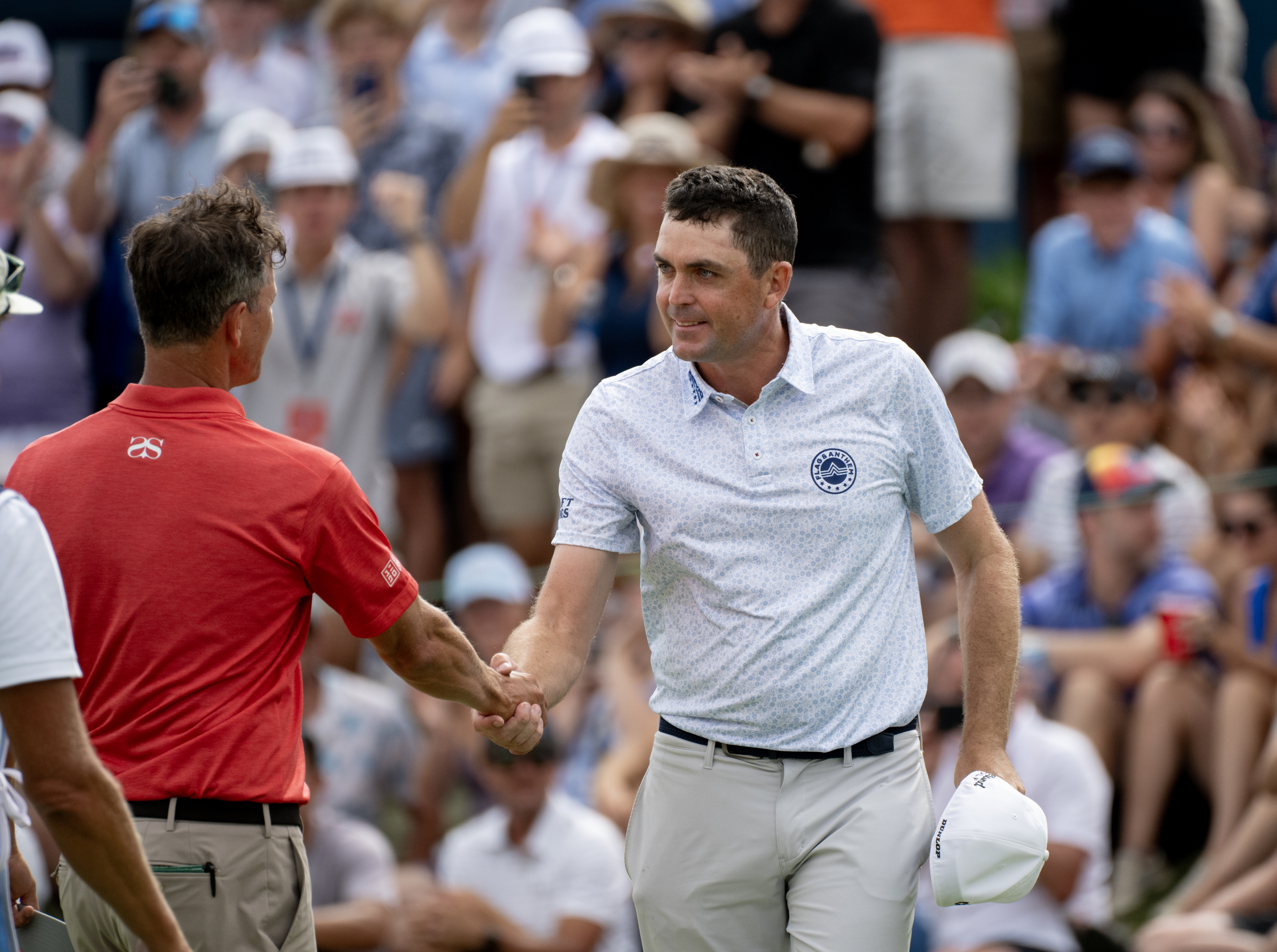 Keegan Bradley shakes hands with Adam Scott after finishing the third round of the BMW Championship at Castle Pines Golf Club, Saturday, Aug. 24, 2024, in Castle Rock, Colo. (Parker Seibold, The Gazette) (Parker Seibold, The Gazette)