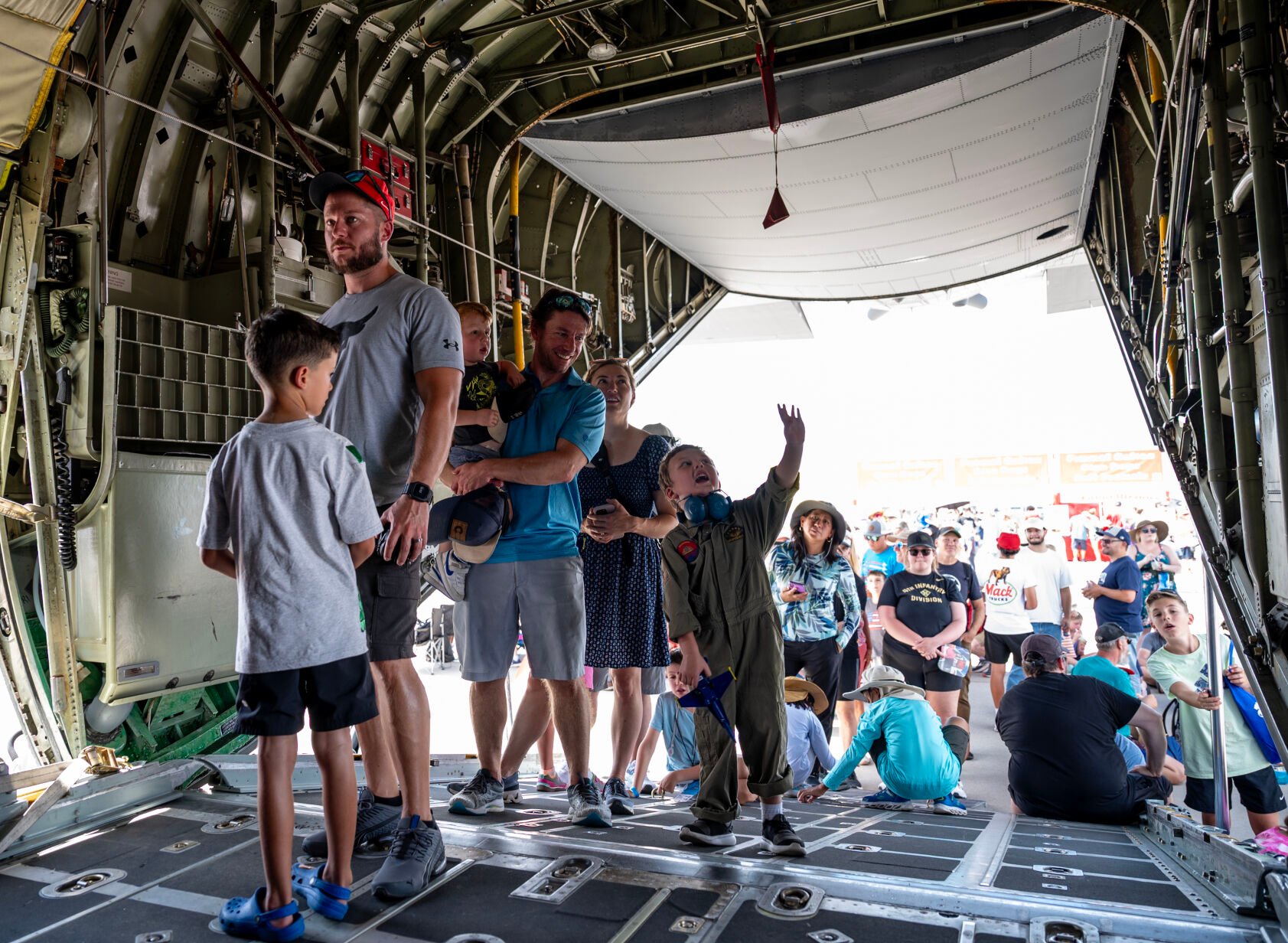 Four-year-old Ellis Dismore points out details inside a C-130 Hercules on display at the Pikes Peak Regional Airshow at the Colorado Springs Airport on Saturday, Aug. 17, 2024. (Parker Seibold, The Gazette) (Parker Seibold The Gazette)