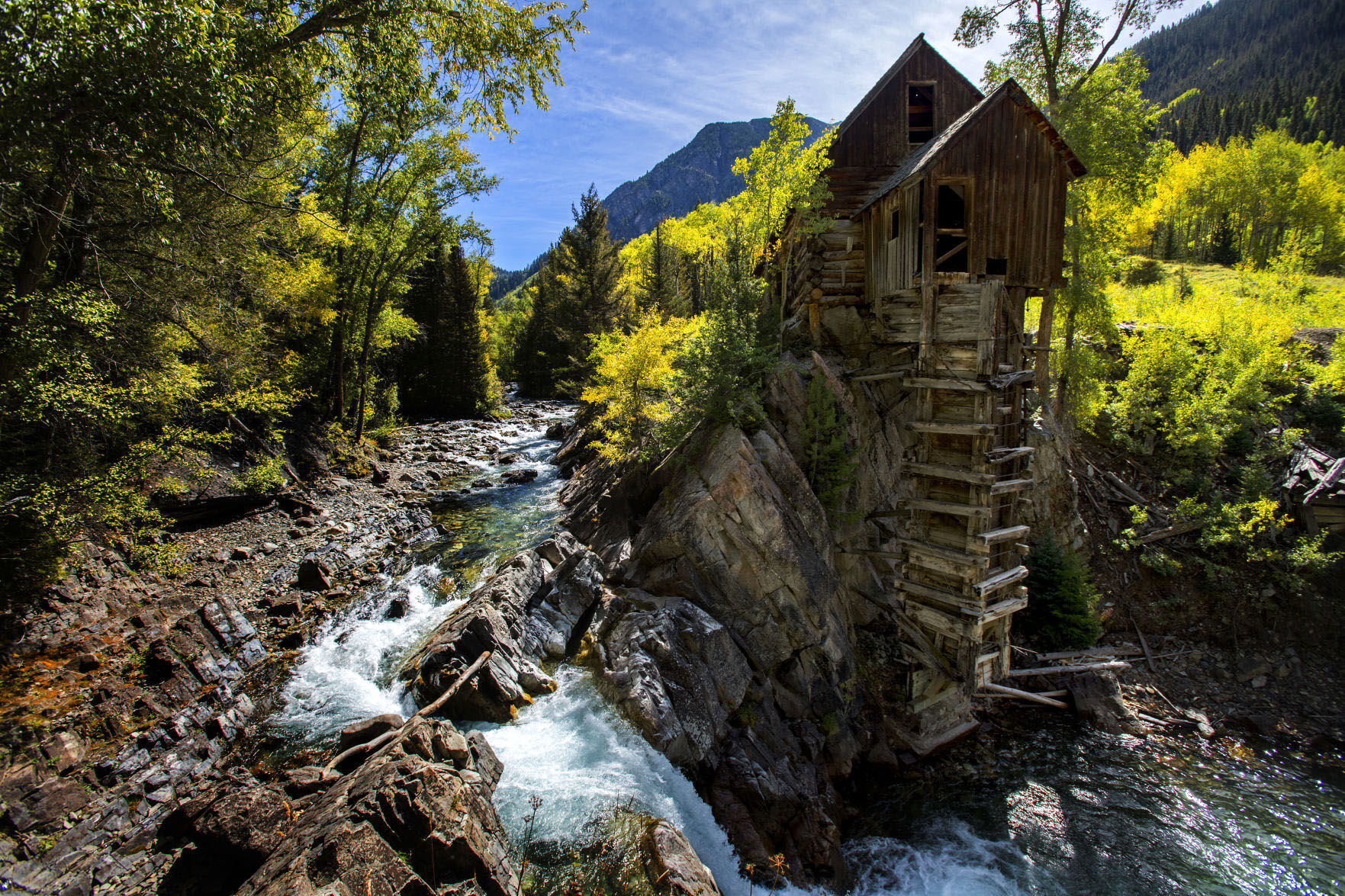 Fall begins to take hold of the aspens surrounding the Crystal Mill, outside Marble, Colo., Tuesday, Sept. 19, 2017. The powerhouse was built in 1892 and operated until the closure of the Sheep Mountain Mine in 1917. (The Gazette, Christian Murdock)