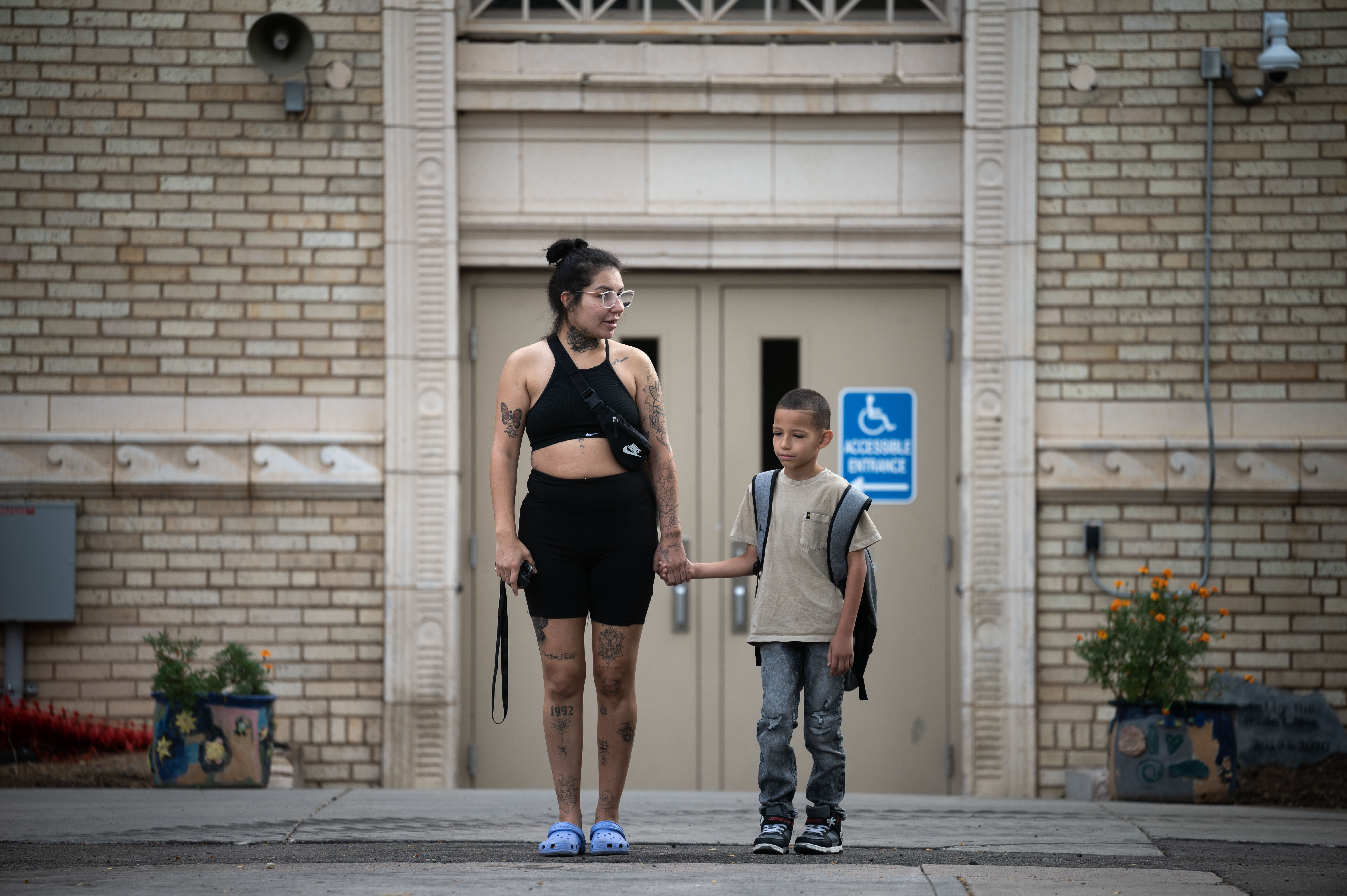 Iesha Roybal stands with her son, Ausar Grimes, 8, before the start of his first day in 3rd grade at Polaris Elementary School in Denver on Monday, Aug. 19, 2024. (Stephen Swofford, Denver Gazette) (StephenSwoffordPhotographerstephen.swofford@gazette.comhttps://secure.gravatar.com/avatar/1ddcaf11c5d70eaa58546ddc4e038687?d=mm&r=g)