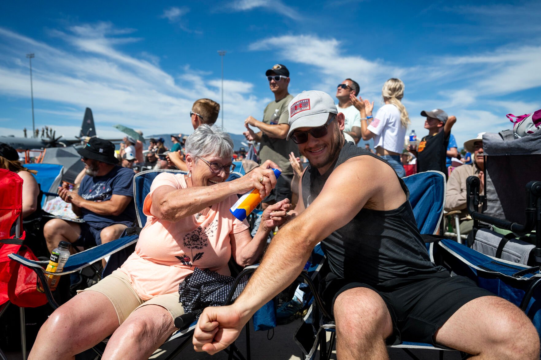Sandy McClure helps her grandson Nick Noble apply sunscreen at the Pikes Peak Regional Airshow at the Colorado Springs Airport on Saturday, Aug. 17, 2024. (Parker Seibold, The Gazette) (Parker Seibold, The Gazette)