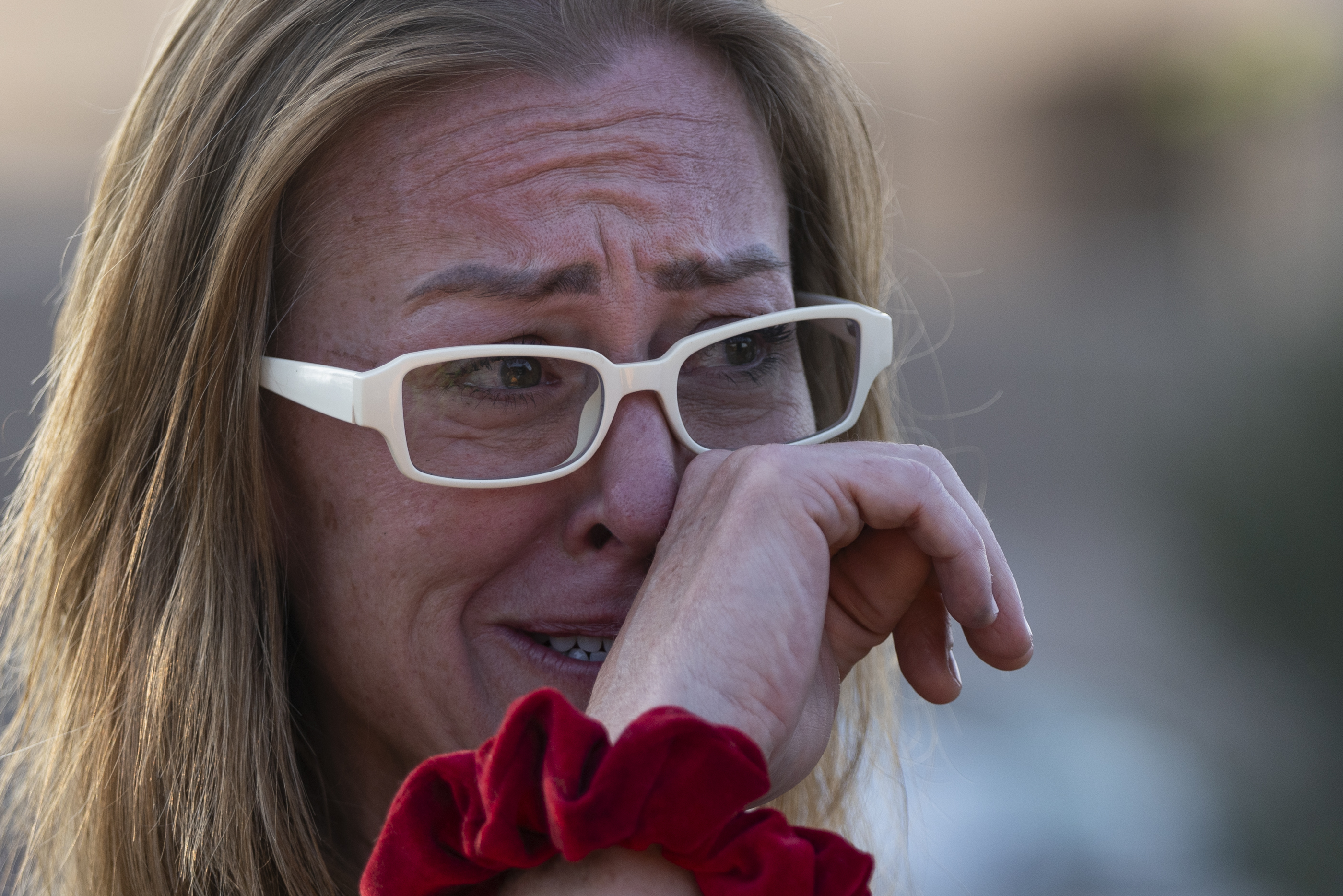 Rachel Pickrel-Hawkins gets choked up while chatting with supporters outside of Larimer County jail, Saturday in Fort Collins. (Rebecca Slezak, special to the gazette)