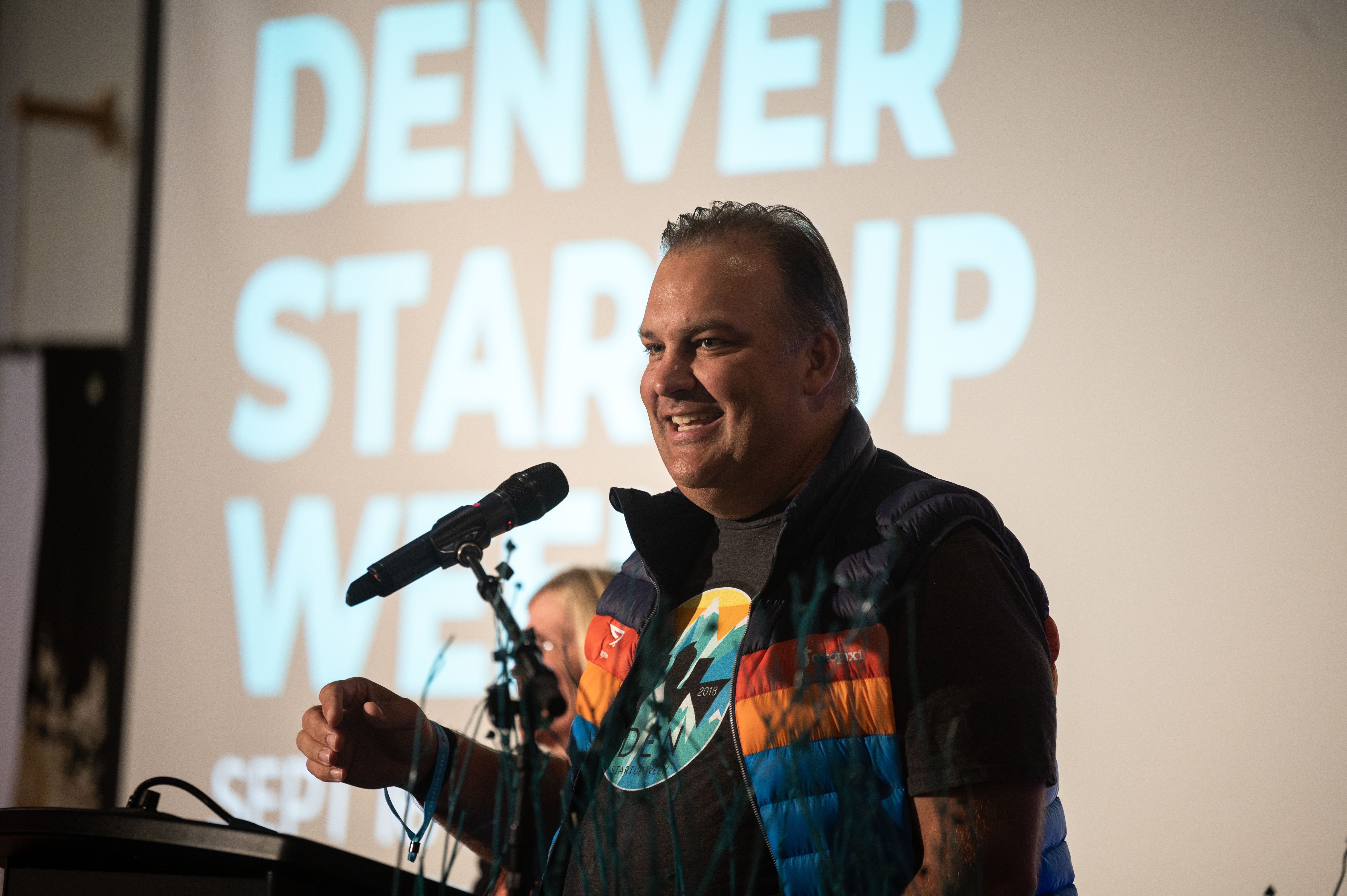 Denver Startup Week Co-Founder Erik Mitisek addresses a crowded room at the start of Denver Startup Week at the McNichols Building in Denver on Tuesday, Sept. 17, 2024. (Stephen Swofford, Denver Gazette) (Stephen Swofford Denver Gazette)