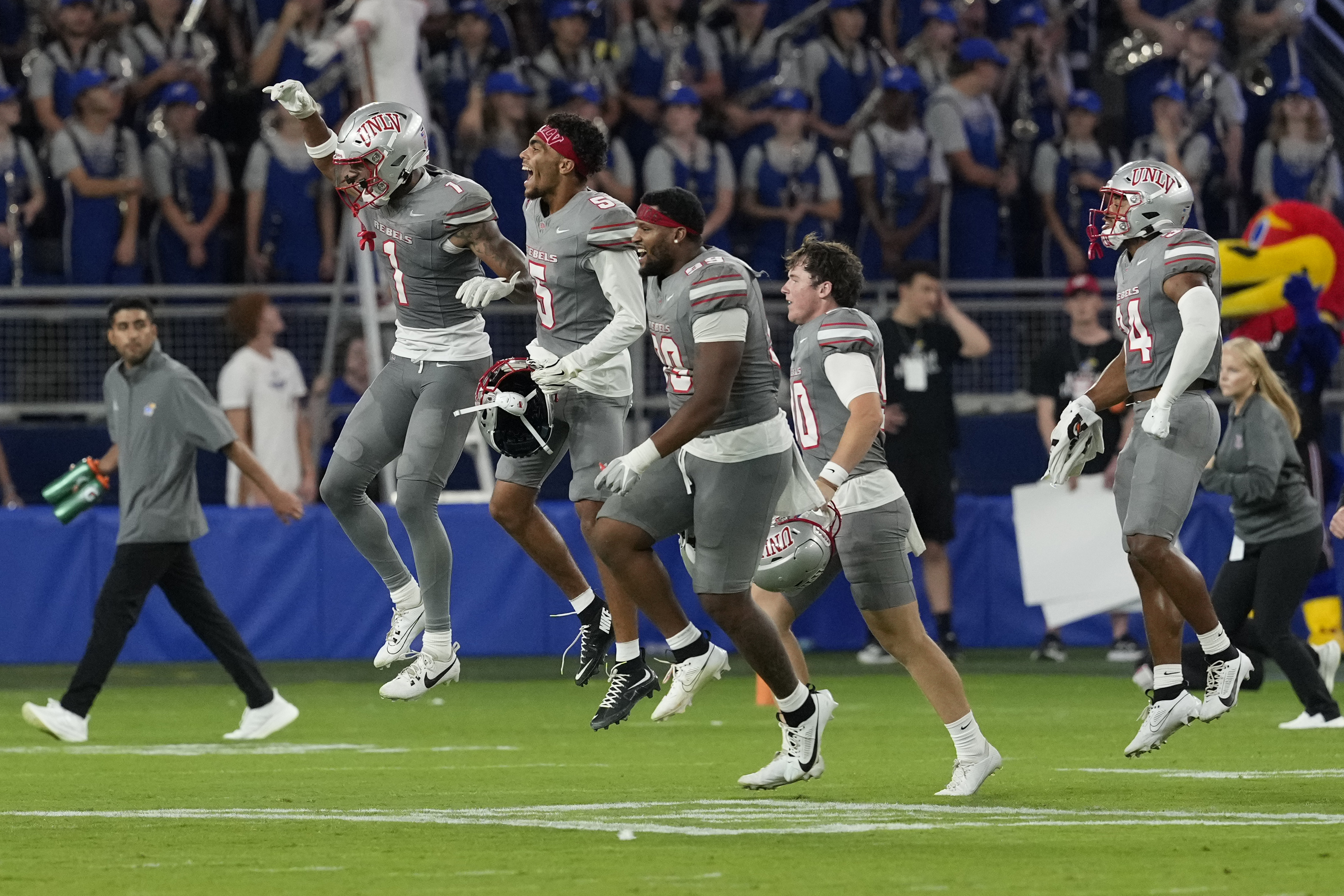 Members of UNLV run onto the field after a 23-20 win over Kansas during an NCAA college football game, Friday, Sept. 13, 2024, at Children's Mercy Park in Kansas City, Kan. (AP Photo/Ed Zurga) (Ed Zurga)