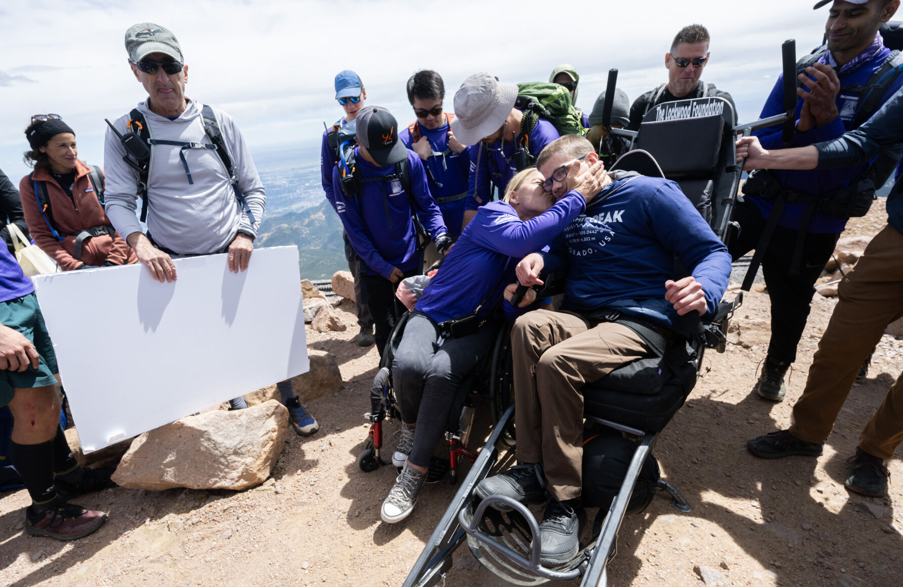 Alongside unlikely team, Colorado teen in wheelchair summits Pikes Peak