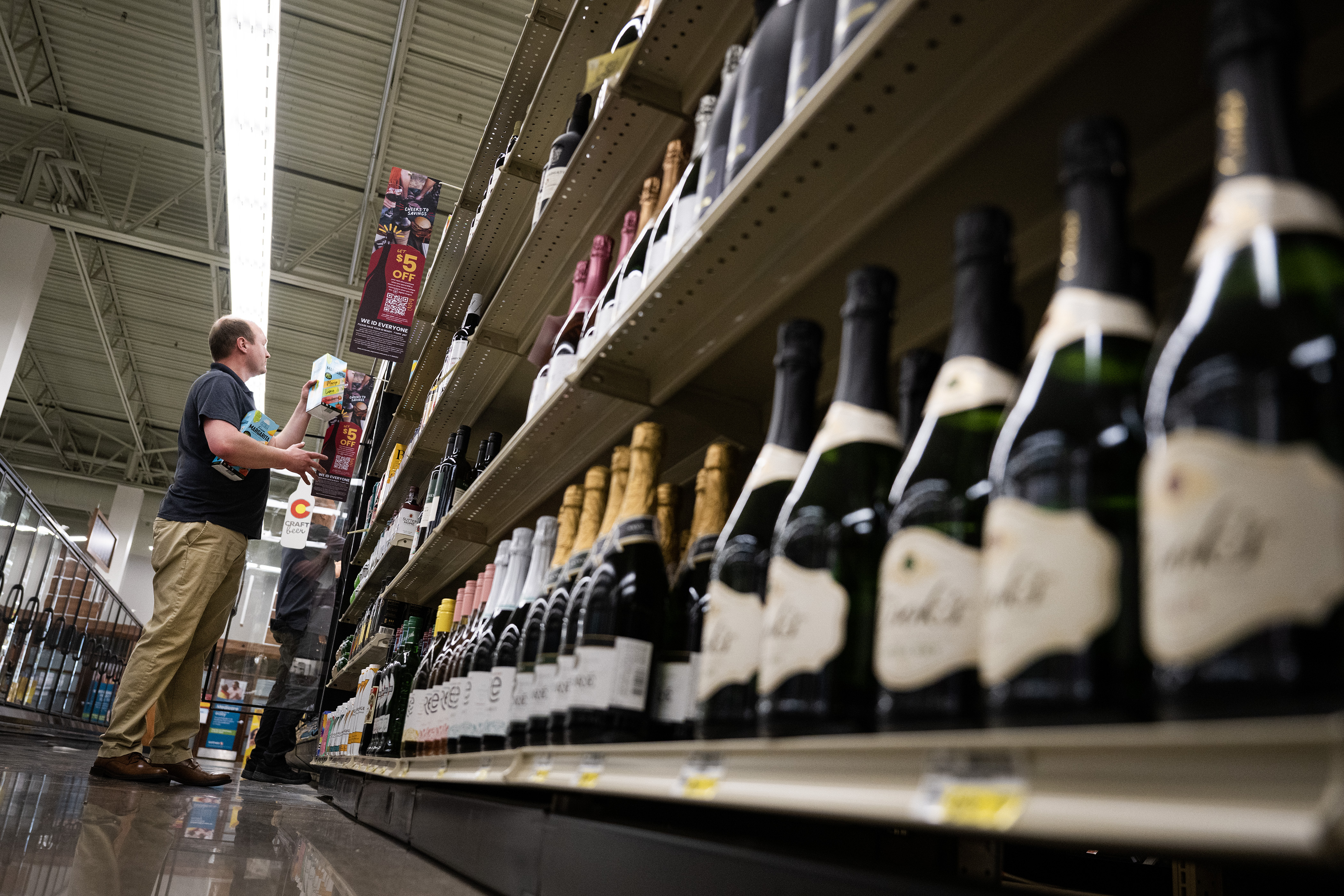 FILE PHOTO: Bryan Morton, with E & J Gallo Winery, helps stock an aisle with wine on Wednesday morning, March 1, 2023, at the Safeway grocery store on South Havana Street in Aurora, Colo. (Timothy Hurst/Denver Gazette) (TimHursttim.hurst@gazette.comhttps://secure.gravatar.com/avatar/aca82bd62b4ee425c598527cd6faa1b1?d=mm&r=g)