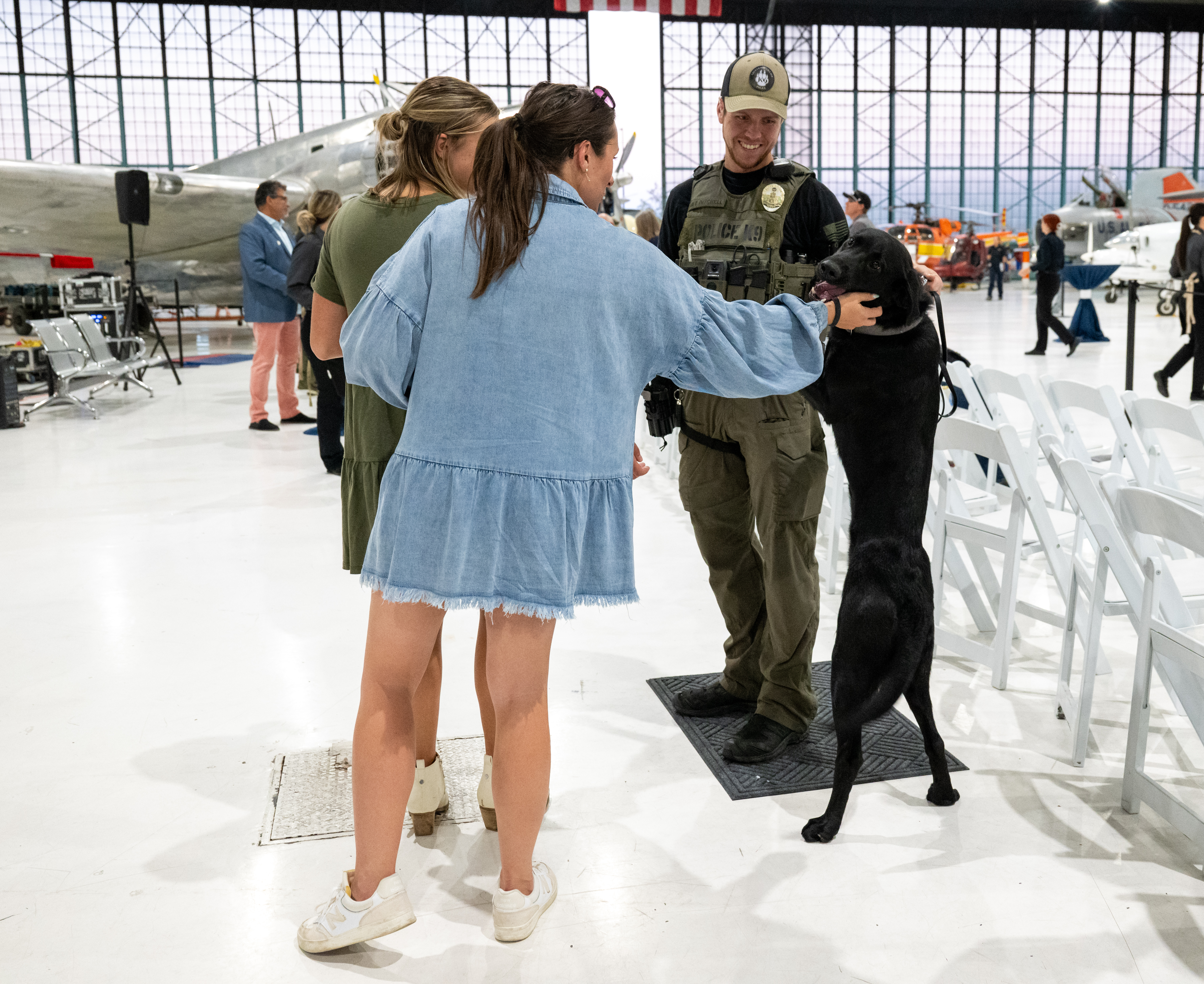 K-9 Titan jumps up on his handler Greenwood Village City Police Department Officer Tyler Mitchell as people come to pet him at the 6th Annual Heroes with Paws event, Wednesday, Sept. 25, 2024, in Denver. (Parker Seibold, The Gazette) (Parker Seibold, The Gazette)