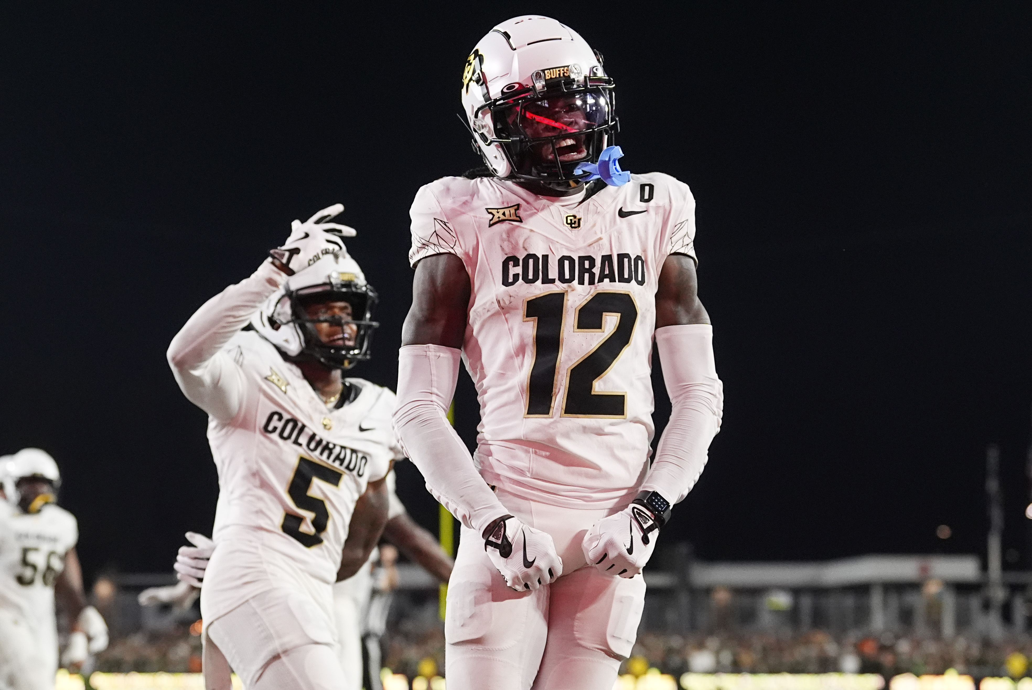 Colorado wide receiver Travis Hunter, right, celebrates after catching a touchdown pass as wide receiver Jimmy Horn Jr. (5) joins in during the second half of an NCAA college football game against Colorado State, Saturday, Sept. 14, 2024, in Fort Collins, Colo. (AP Photo/David Zalubowski) (David Zalubowski)