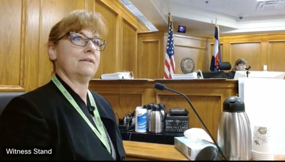 Boulder Police Department Criminalist Wendy Kane shows the jury video footage of Ahmad Alissa in the hospital after the mass shooting in 2021. Kane visited Alissa in the hospital to take photographic evidence of his leg wound and other personal items. (Screengrab of the 20th Judicial District's live feed via WebEx)