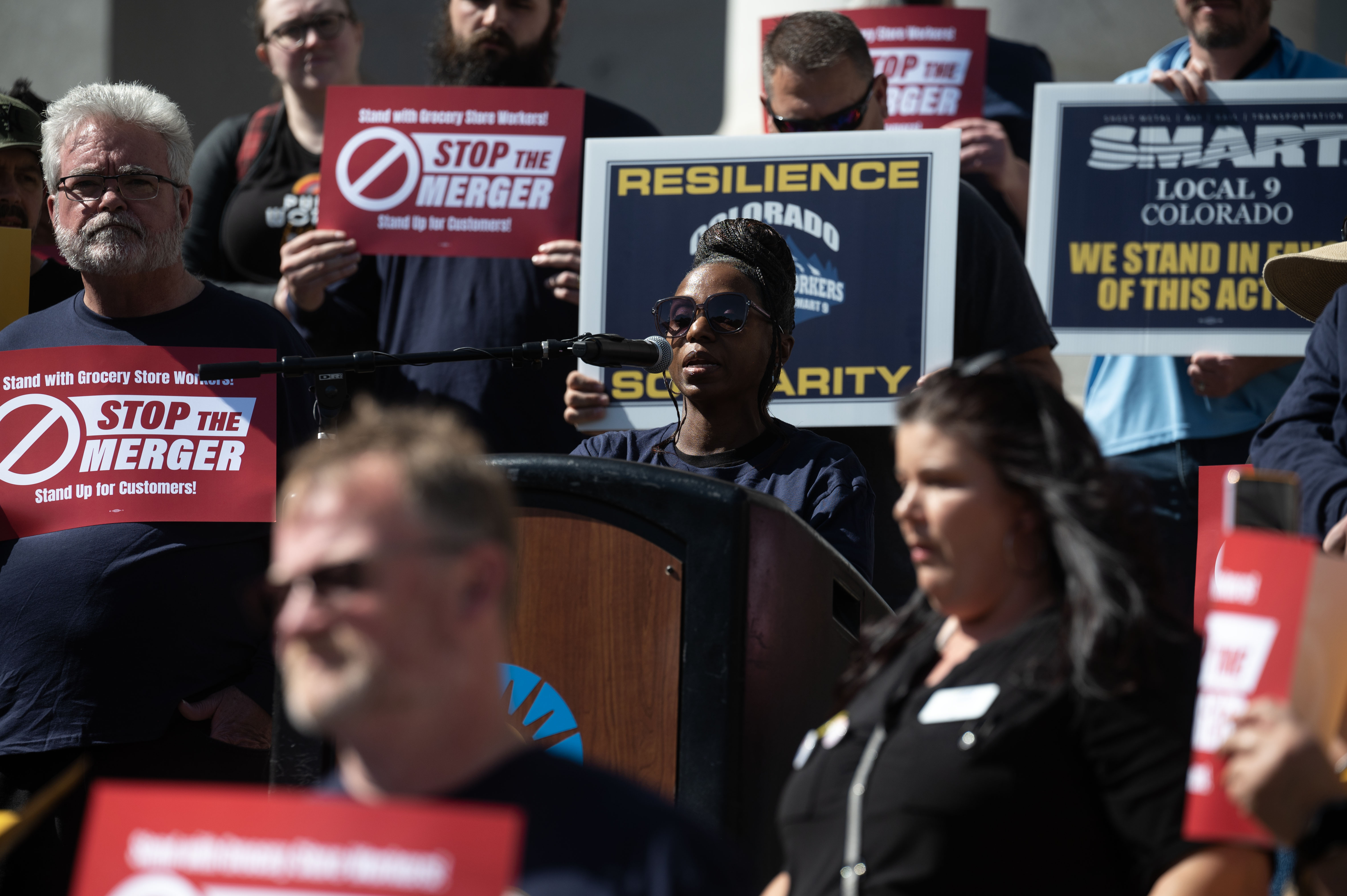 UFCW Local 7 member Carol McMillan gives remarks to the press during a rally calling for a stop to the merger between Kroger and Albertsons outside the Denver City and County Building on Monday, Sept. 30, 2024 (Stephen Swofford, Denver Gazette) (StephenSwoffordPhotographerstephen.swofford@gazette.comhttps://secure.gravatar.com/avatar/1ddcaf11c5d70eaa58546ddc4e038687?d=mm&r=g)