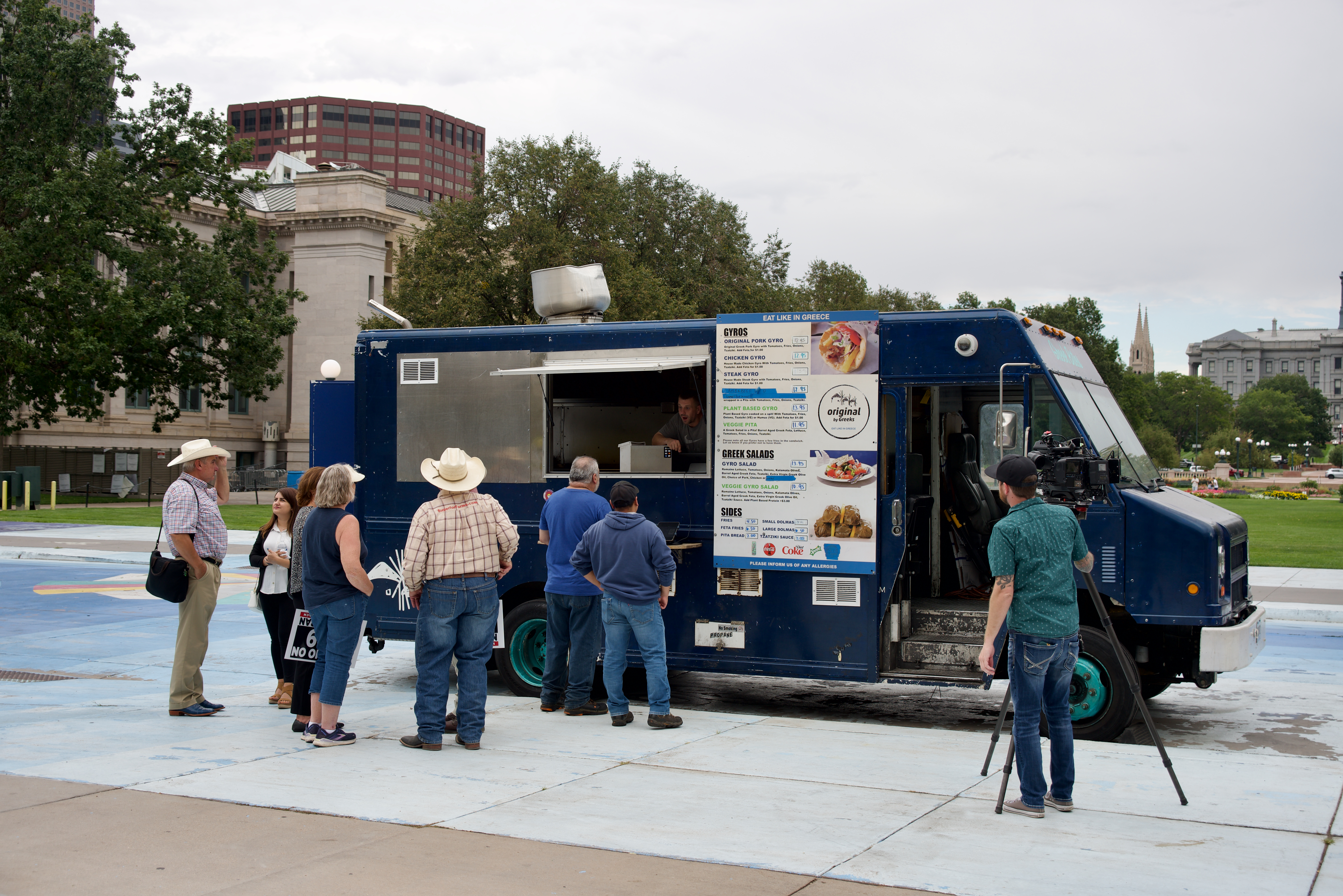 People gather outside a food truck serving lamb, beef and pork products following a press conference opposing a ban of slaugtherhouses in Denver. (Alex Edwards/The Denver Gazette) (AlexanderEdwardsBusiness Reporteralex.edwards@gazette.comhttps://secure.gravatar.com/avatar/dbaa50cc8a9183e280c297e3afa72ace?d=mm&r=g)