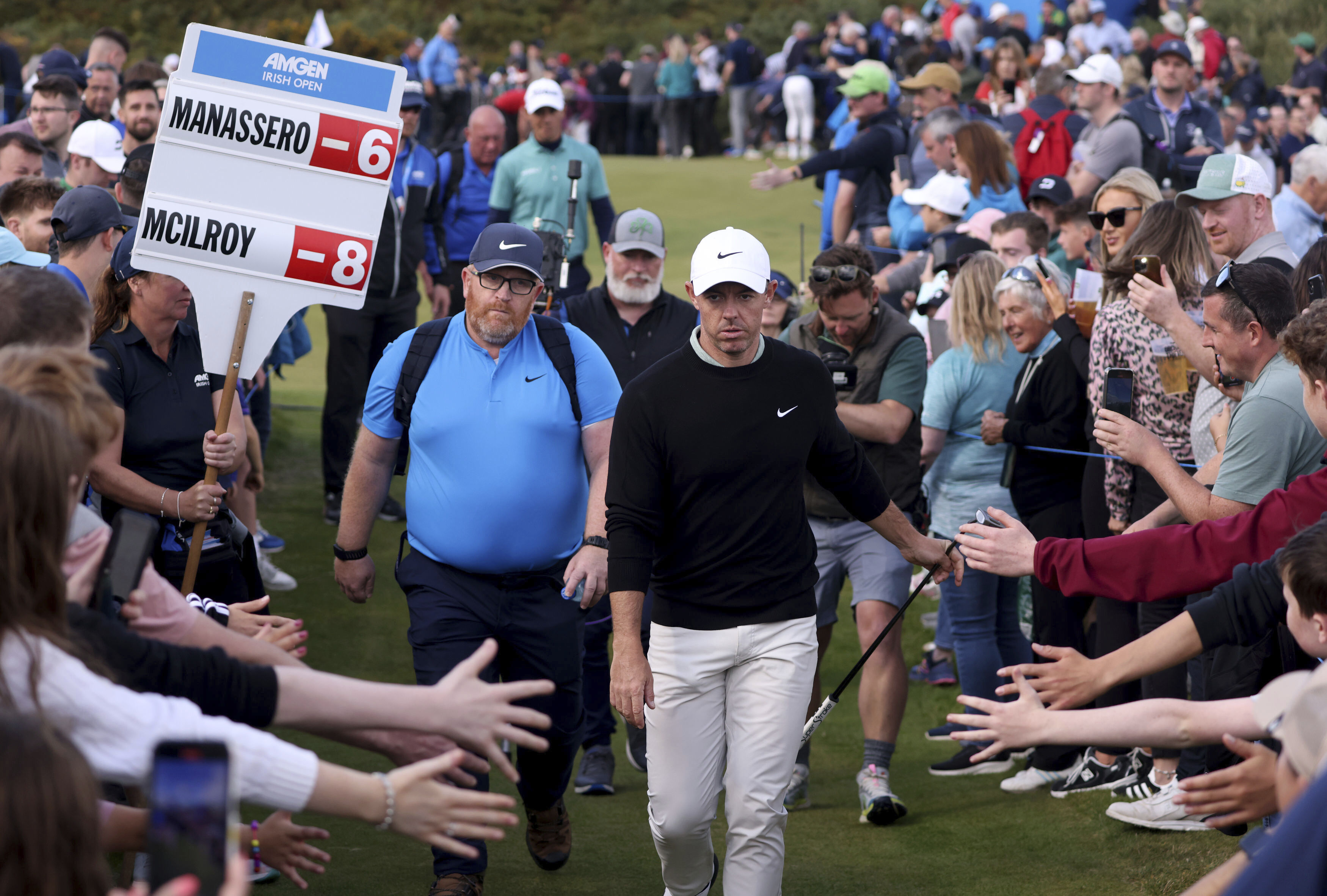 Northern Ireland's Rory McIlroy walks between lines of fans as he makes his way to the thirteenth tee during day four of the Amgen Irish Open 2024 at Royal County Down in Newcastle, County Down, England, Sunday Sept. 15, 2024. (Peter Morrison/PA via AP) (Peter Morrison)