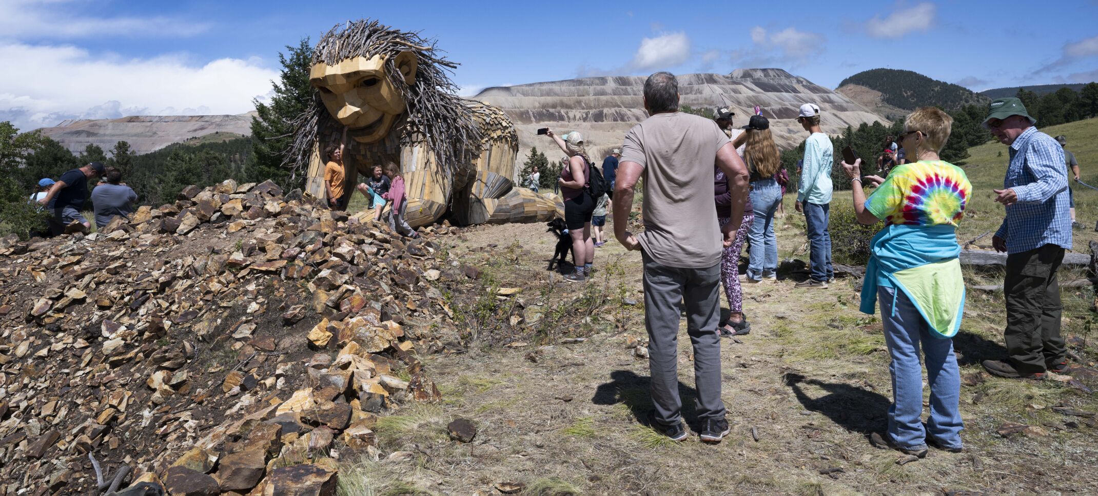 Visitors surround Rita the Rock Planter troll created by Danish artist Thomas Dambo outside Victor last month on the first weekend it was open to the public. The troll is Dambo’s second in Colorado. His first is in Breckenridge. The troll is a short distance from the Little Grouse Mountain trailhead outside Victor toward Cripple Creek along Colorado 67. (Christian Murdock, PIKES PEAK COURIER)