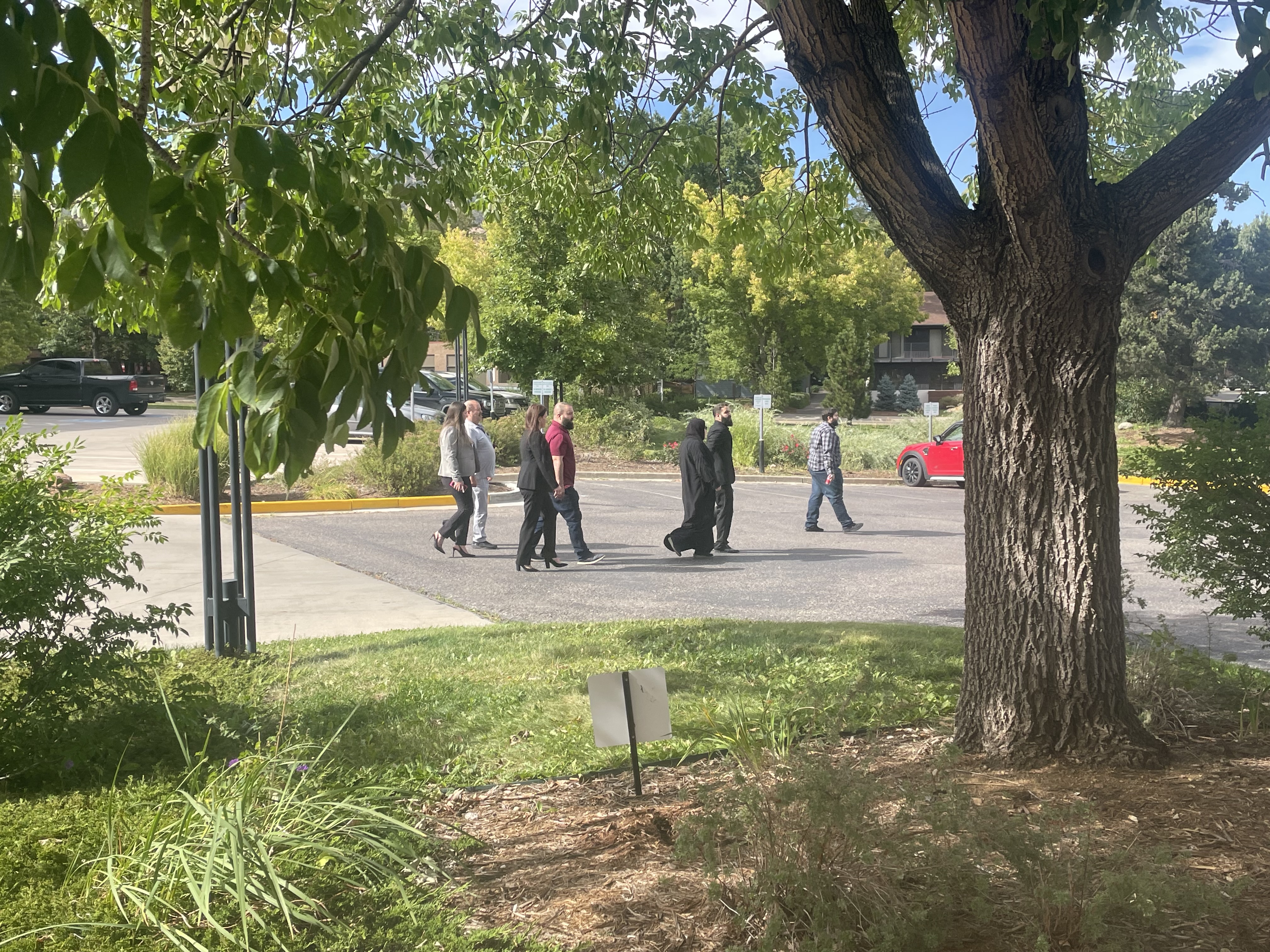 Ahmad Alissa's family members walk on court grounds on Friday, Sept. 20, when the prosecution and the defense made their closing arguments to the jury that will decide the fate of the man accused of killing 10 people at a King Soopers in Table Mesa in Boulder in March 2021.